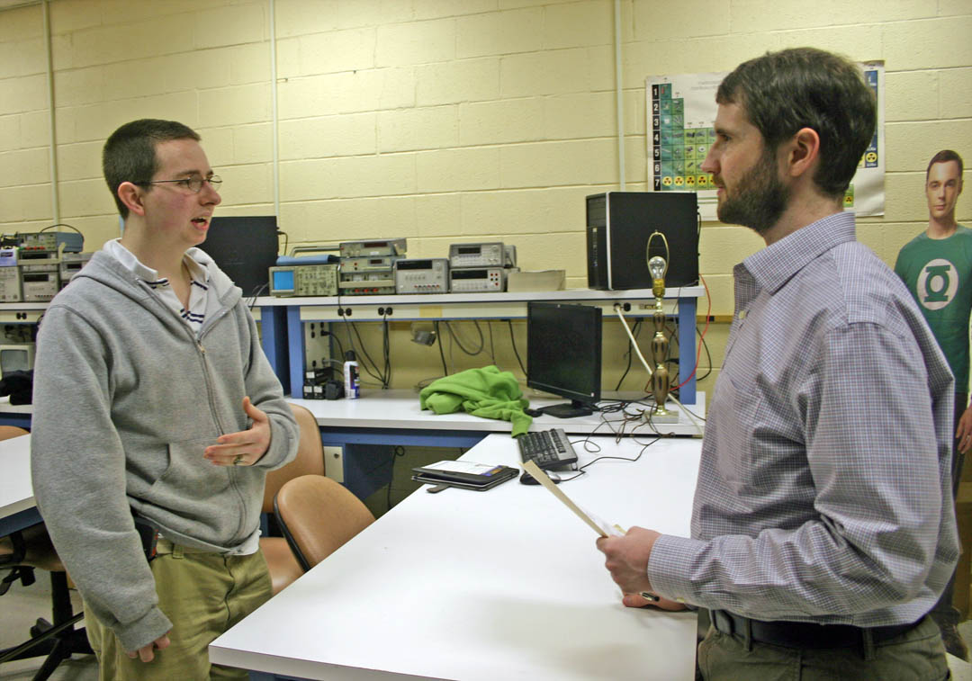 Click to enlarge,  Central Carolina Community College laser and photonics student Joseph Price (left), of Erwin, speaks with Winston Parker (right), Cree, Inc. laser fabrication manager, about employment opportunities at the company. They spoke following a Feb. 26 presentation by Parker and company recruiters at the college's Harnett County Campus, in Lillington. Cree, headquartered in Durham, is an international leader in research, innovation and production in light-emitting diode (LED) and radio frequency (RF) technologies. The Cree representatives said graduates of the college's laser and photonics, electronics engineering, and computer engineering programs are well prepared to work at their company. For more information about engineering technologies programs offered at CCCC, visit www.cccc.edu. 
