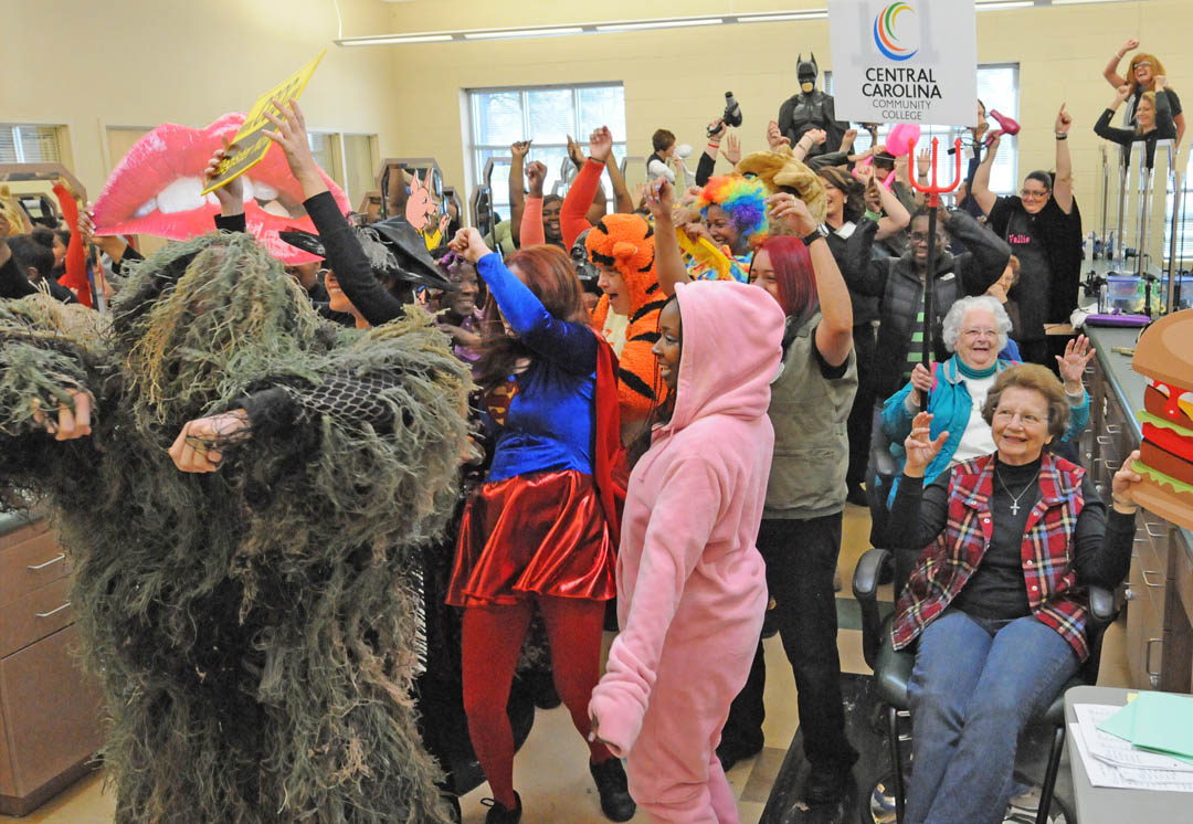 Click to enlarge,  Central Carolina Community College, known for its academics and cutting-edge programs, showed its fun side on March 7 at the Harnett County Campus, in Lillington. Cosmetology students, joined by the college mascot, Charlee Cougar, their clients and other students, had a blast creating a 'Harlem Shake' video, the latest YouTube video meme craze. For 30 seconds, they grooved to the tune 'Harlem Shake' by electronic musician Baauer. The event, held in the Cosmetology salon, drew an appreciative audience of students and staff. To see the video, visit www.cccc.edu. 