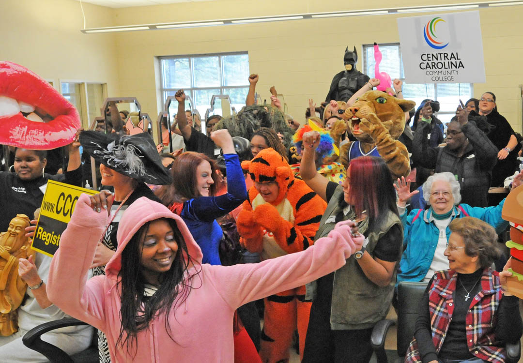 Click to enlarge,  Central Carolina Community College, known for its academics and cutting-edge programs, showed its fun side on March 7 at the Harnett County Campus, in Lillington. Cosmetology students, joined by the college mascot, Charlee Cougar (back, right), their clients and other students, had a blast creating a 'Harlem Shake' video, the latest YouTube video meme craze. For 30 seconds, they grooved to the tune 'Harlem Shake' by electronic musician Baauer. The event, held in the Cosmetology salon, drew an appreciative audience of students and staff. To see the video, visit www.cccc.edu. 