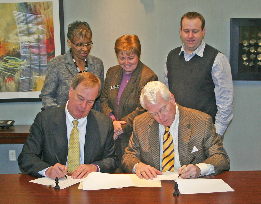 Click to enlarge,  Central Carolina Community College and North Carolina Wesleyan College signed an articulation agreement Feb. 26 at CCCC to enable the community college's students to transfer seamlessly to the four-year institution. The agreement, signed by CCCC President Dr. Bud Marchant (front left) and N.C. Wesleyan President James Gray III, covers Associate in Arts and Associate in Science degree graduates, as well as graduates in several Associate in Applied Science degree programs. Also attending the signing were (back, from left) Saundra Carmichael, director of NCWC's Triangle ASPIRE program; Dr. Lisa Chapman, CCCC executive vice president for Instruction; and Dr. Evan Duff, NCWC interim provost and vice president of Adult and Professional Studies. For more information about CCCC programs, go to www.cccc.edu. For more information about N.C. Wesleyan, visit www.ncwc.edu. 