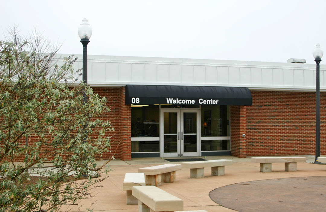 Click to enlarge,  Central Carolina Community College's Lee County Campus now has a 'front door': the Bell Welcome Center. The former Bell Hall, located to the left of the plaza at the campus' main entrance, has been renovated and now houses the Admissions, Testing, and Career Counseling offices of the Student Services Division of the college. Those three offices are the first that entering students have contact with as they come to the college. The offices were moved from tight quarters in Hockaday Hall, where they had been since 1975. The more spacious facility at the main entrance to the campus provides a welcoming atmosphere as well as increased access to services for students. The 7,680-square-foot building was first constructed in 1973 as the college's Adult Education Building. In 1975, it was renamed Bell Building, in honor of Dr. Edwin A. Bell, who had been director of the evening school from 1966 to 1973. Bell was the first person to have one of the college's buildings named after him. The Bell name has been retained to continue to honor his service to the college. For more information about services offered by the Student Services Division, go to www.cccc.edu/studentservices/. 