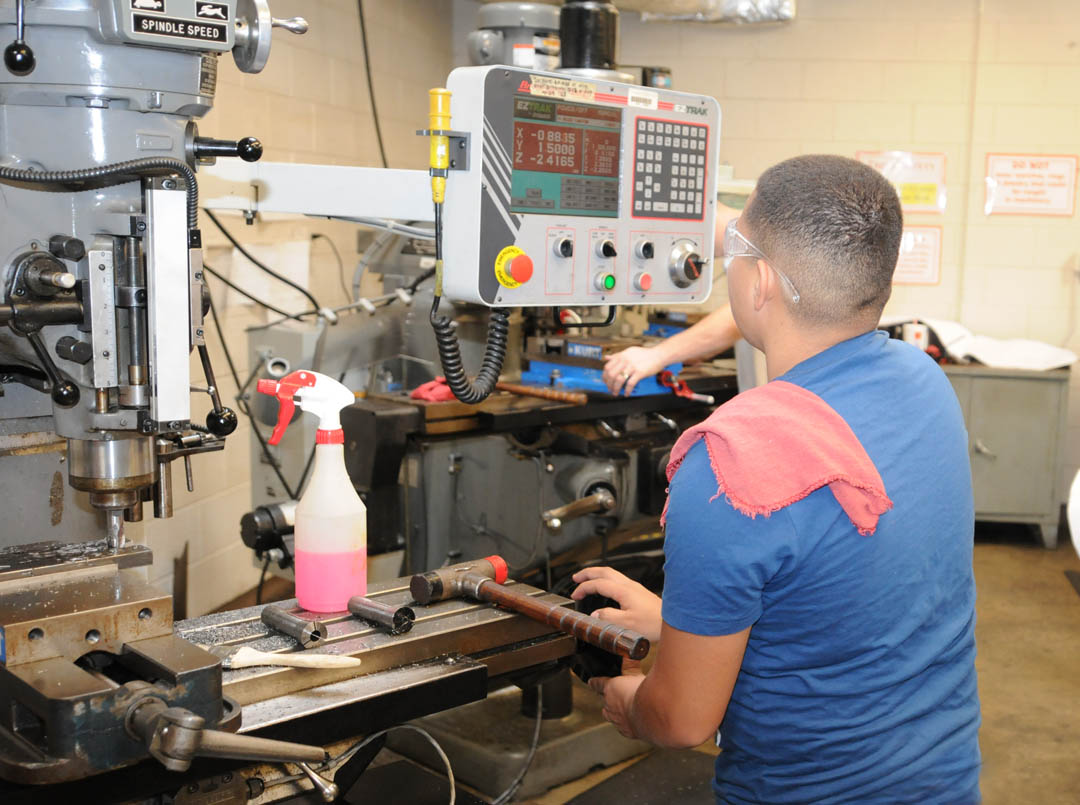 Click to enlarge,  A Central Carolina Community College machining student operates a manual mill with electronic read-out during a class in Computer Integrated Machining. For the quality of its Machining program, CCCC has been recognized by The Manufacturing Institute as a charter member of its 'M-List.' Only 39 institutions of higher learning nationwide made the list, recognizing that they train students to meet National Association of Manufacturers-Endorsed Manufacturing Skills Certifications as a standard part of their manufacturing education programs. For more information about Central Carolina Community College's manufacturing training and other programs, visit www.cccc.edu/curriculum. 