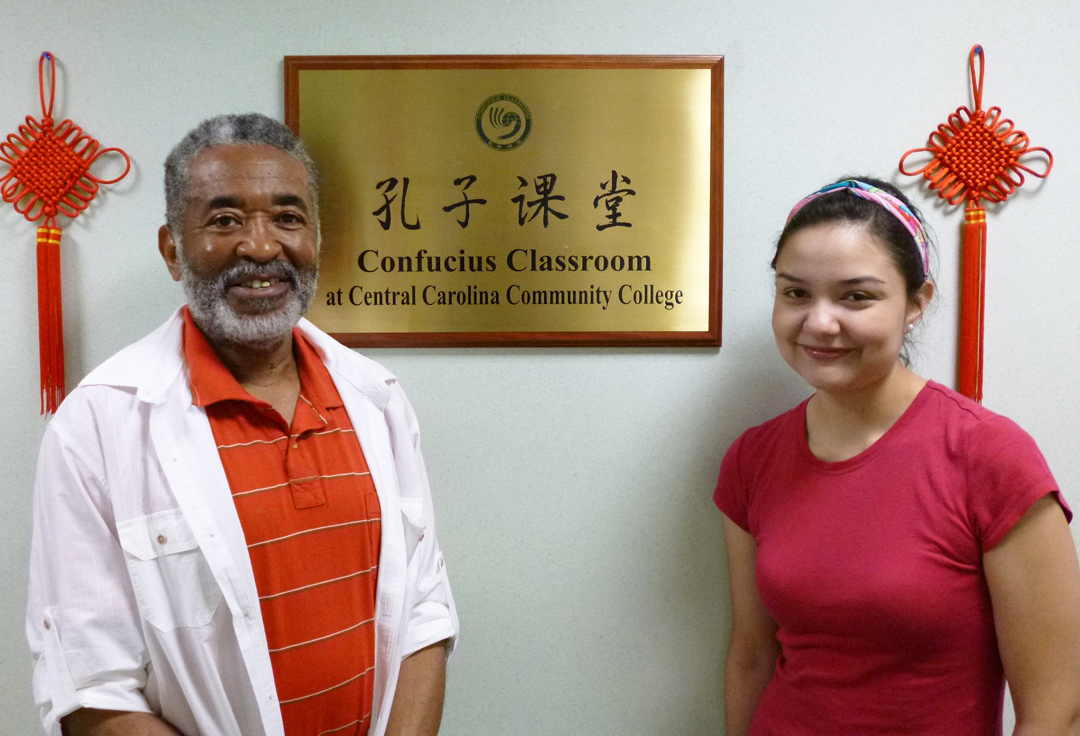 Click to enlarge,  Central Carolina Community College Confucius Classroom students (from left) Charles Sutherland and Cynthia Molina, both of Sanford, have received recognition from the North Carolina Chinese Speech Contest. Organized by the Confucius Institute at N.C. State University, the contest is open to non-native Chinese speakers of any age who are state residents. Sutherland earned the Honor Award for the Beginner Level in the preliminary competition with a five-minute self-introductory video highlighting his mastery of the language. At the finals, held May 4 at NCSU, Molina placed fifth among the Beginner Level finalists. She read a prepared Chinese passage and was scored on intonation, emotion and basic comprehension. Both have completed two semesters of Chinese language courses at CCCC under instructor Ling Huang. Huang, who teaches English at Nanjing Normal University in the People's Republic of China, has been teaching at CCCC since 2011. CCCC's Confucius Classroom is a partnership between NCSU's Confucius Institute and the college. CCCC was the first community college in the U.S. to have a Classroom. The Institute and Classroom promote intercultural exchanges through educational and outreach activities. For more information about the Confucius Classroom, visit  www.cccc.edu/confucius . 