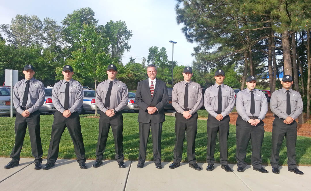 Click to enlarge,  Central Carolina Community College's Basic Law Enforcement Training day program graduated seven cadets during a ceremony May 13 at the Dennis A. Wicker Civic Center. Pictured (from left) are graduates Jacob Davis, of Lillington, who received the Most Improved Physical Fitness Award; Benjamin Warren, of Pittsboro, who received the Highest Grade Point Average Award; Nicholas Kehagias, of Sanford, who received the Fastest Police Officer Physical Abilities Test (POPAT) and Highest State Exam Average awards; BLET Director Robert Powell; Joseph Myatt, of Spring Lake; Jeremy Timmons, of Pittsboro, who received the Jimmy Collins Memorial Top Gun and Highest Grade Point Average awards; and David Green and Ellmar Benitez, both of Sanford. The cadets completed 624 hours of law enforcement training, passed all 35 blocks of instruction, passed a rigorous 12-week physical training program, and passed a four-hour written comprehensive state examination administered by the state Criminal Justice Training and Standards Division. All graduates are qualified to be certified law enforcement officers in North Carolina. For more information about the college's BLET program, visit www.cccc.edu/blet or contact Robert Powell at rpowell@cccc.edu or 919-777-7774. 