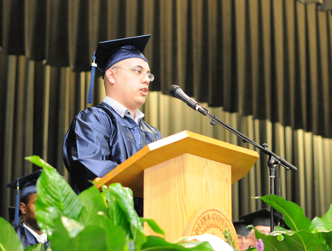 Click to enlarge,  Gustavo Rivera, of Lee County, addresses Central Carolina Community College's Adult High School/General Educational Development graduation Jan. 16 in the Dennis A. Wicker Civic Center. Rivera received his GED and plans to continue his education. More than 400 students earned high school or GED diplomas - the largest graduating class, by far, for adult education in the college's history. About 250 attended the graduation exercises. For more information about Central Carolina Community College's AHS/GED programs, visit www.cccc.edu or contact a College and Career Readiness coordinator: Chatham County, 919-545-8661 or dloges@cccc.edu; Harnett County, 910-814-8972 or mmcgee@cccc.edu; or Lee County, 919-777-7703 or esmith@cccc.edu. Para mas informacion en espanol - 919-545-8667 or jherbon@cccc.edu. 