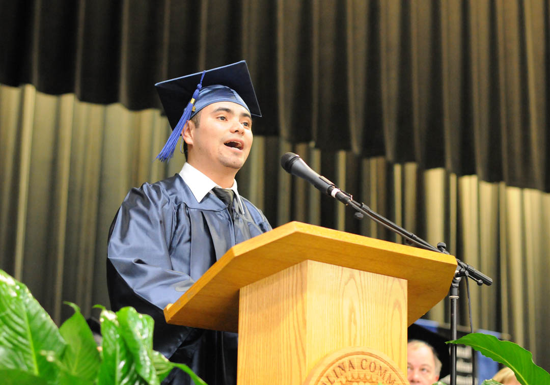 Click to enlarge,  Yony Reyes Sanchez, of Chatham County, addresses Central Carolina Community College's Adult High School/General Educational Development graduation Jan. 16 in the Dennis A. Wicker Civic Center. More than 400 students earned high school or GED diplomas - the largest graduating class, by far, for adult education in the college's history. About 250 attended the graduation exercises. For more information about Central Carolina Community College's AHS/GED programs, visit www.cccc.edu or contact a College and Career Readiness coordinator: Chatham County, 919-545-8661 or dloges@cccc.edu; Harnett County, 910-814-8972 or mmcgee@cccc.edu; or Lee County, 919-777-7703 or esmith@cccc.edu. Para mas informacion en espanol - 919-545-8667 or jherbon@cccc.edu. 