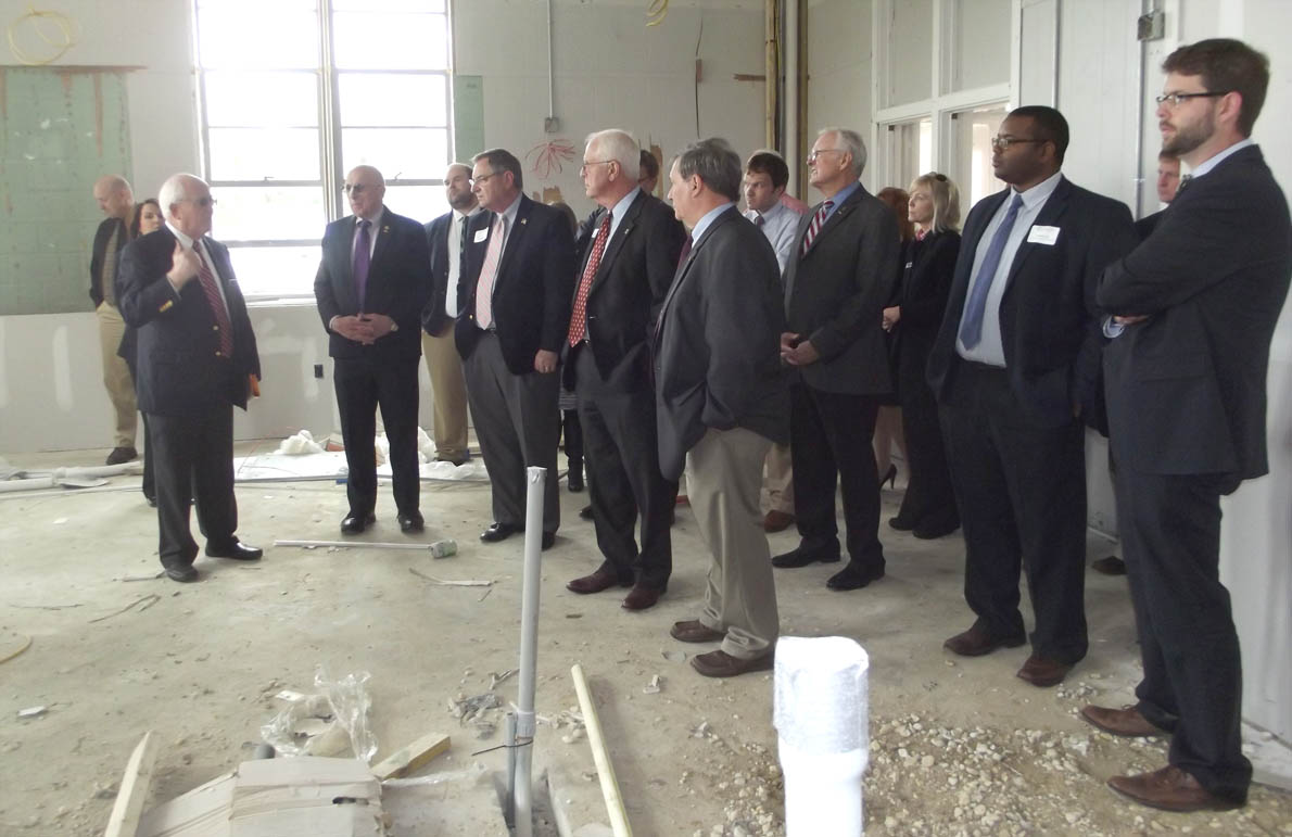 Click to enlarge,  Bill Tyson (at left), Central Carolina Community College Harnett County Provost, shows off one of the facilities that the college will utilize at the Dunn Center. 