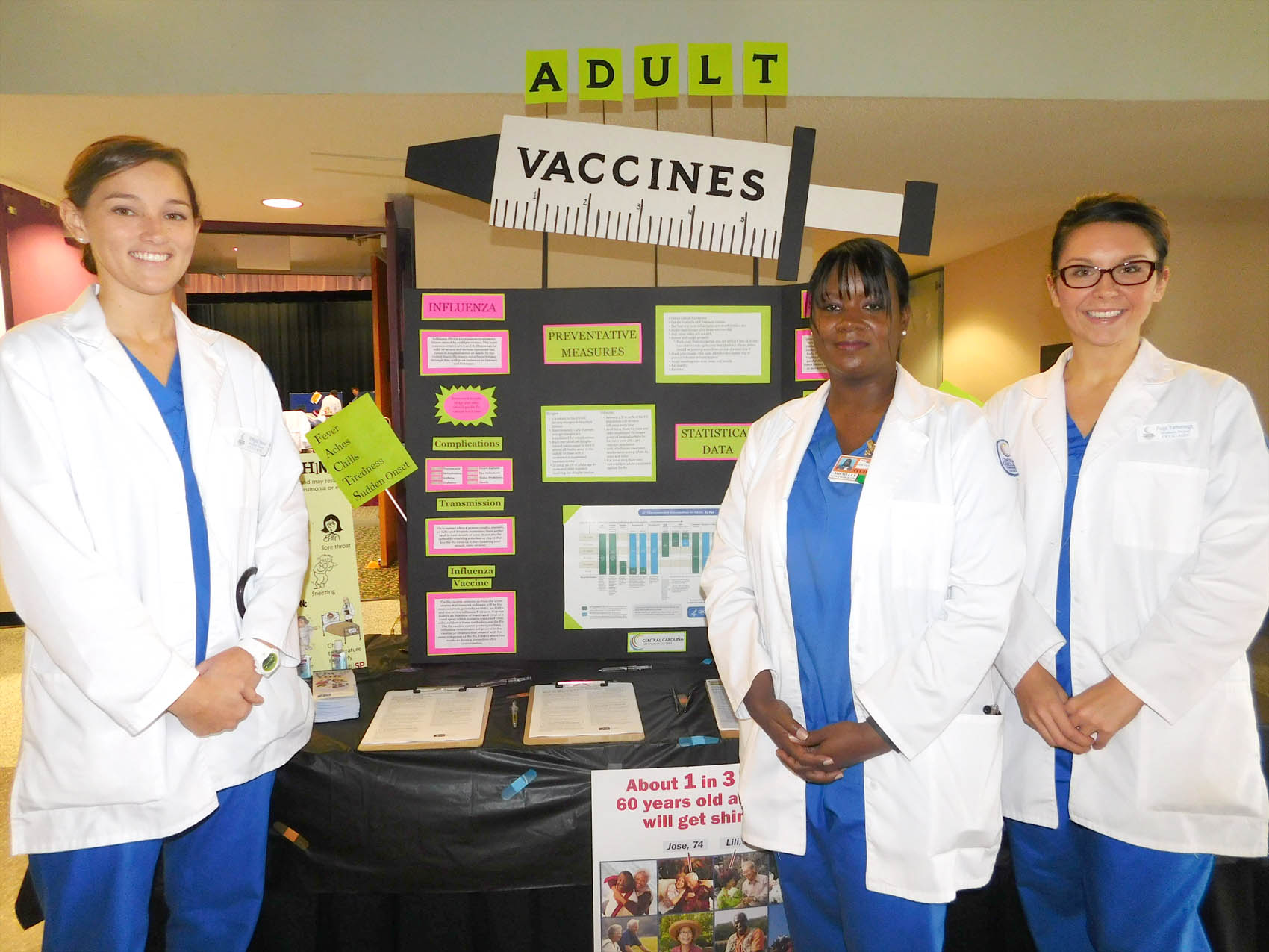 Click to enlarge,  Central Carolina Community College School of Nursing students Abbigail Hauser, Michelle Durham, and Paige Yarborough were pictured during the Lee County Schools/CCCC Family Health &amp; Benefits Fair on Tuesday, Nov. 3, at the Dennis A. Wicker Civic Center. 
