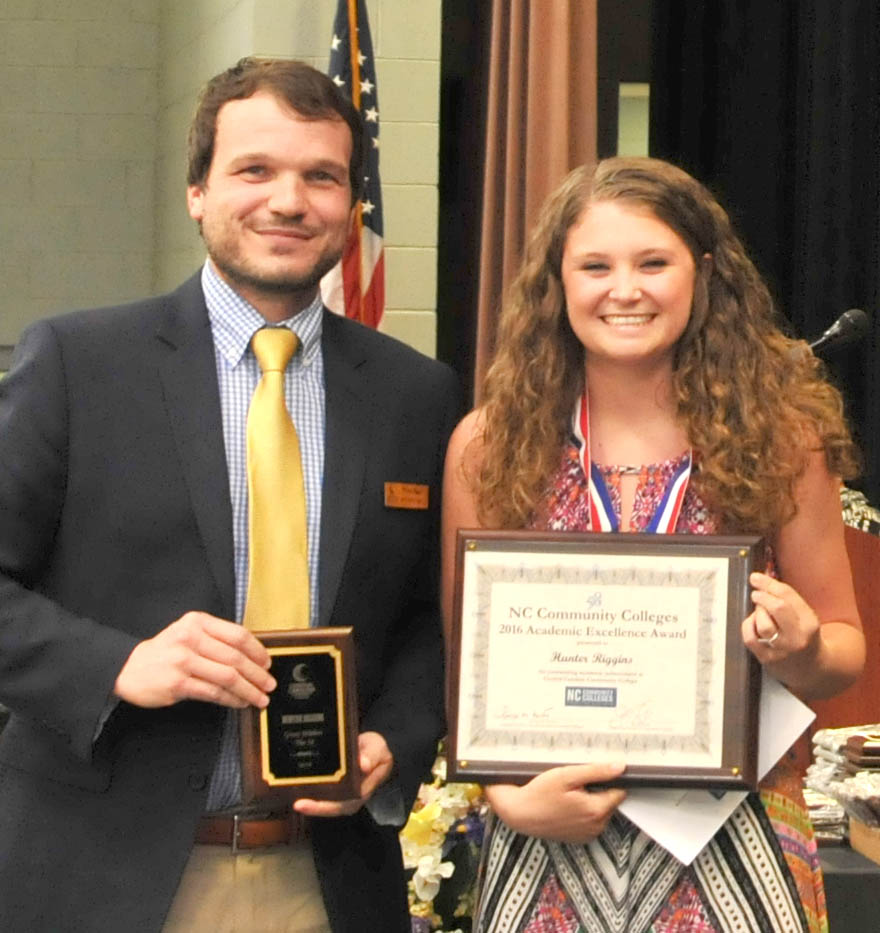 Click to enlarge,  Hunter Riggins (right) is Central Carolina Community College's winner of the N.C. Community College System's Great Within the 58 Academic Excellence Award winner. Presenting the award to Phillips is Mike Beck, CCCC Dean of Student Learning. 