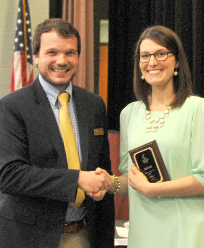 Click to enlarge,  Megan Blair (right) is Central Carolina Community College's nominee for the N.C. Community College System's Gov. Robert Scott Award. Presenting the award to Blair is Mike Beck, CCCC Dean of Student Learning. 