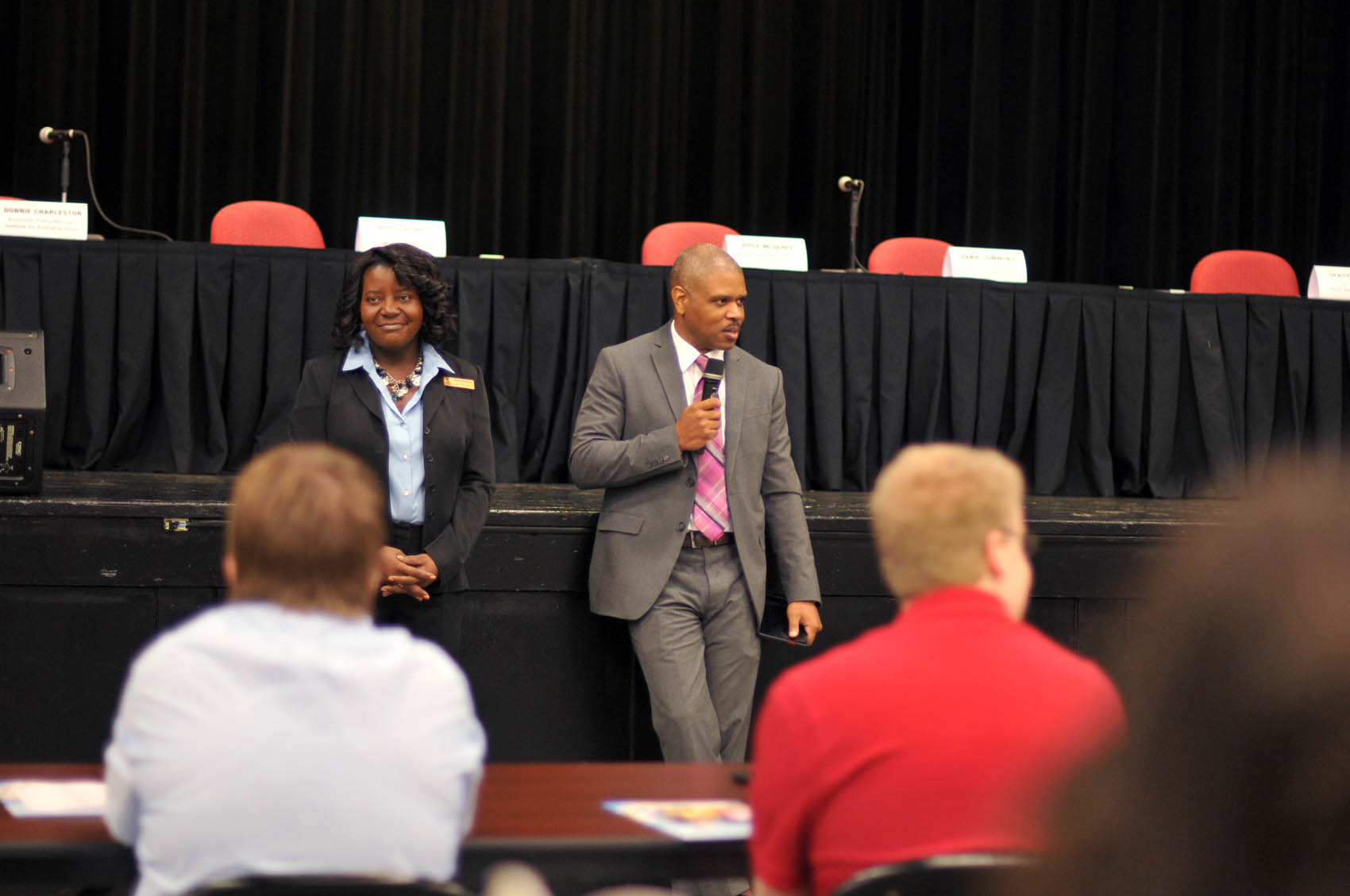 Click to enlarge,  Mary Parker, CCCC Career Center Coordinator, and Donnie Charleston, Economy Policy Manager, Institute for Emerging Issues, speak to the participants of the FutureWork Prosperity Tour 2016 event on Wednesday, June 22, at the Dennis A. Wicker Civic Center in Sanford. 