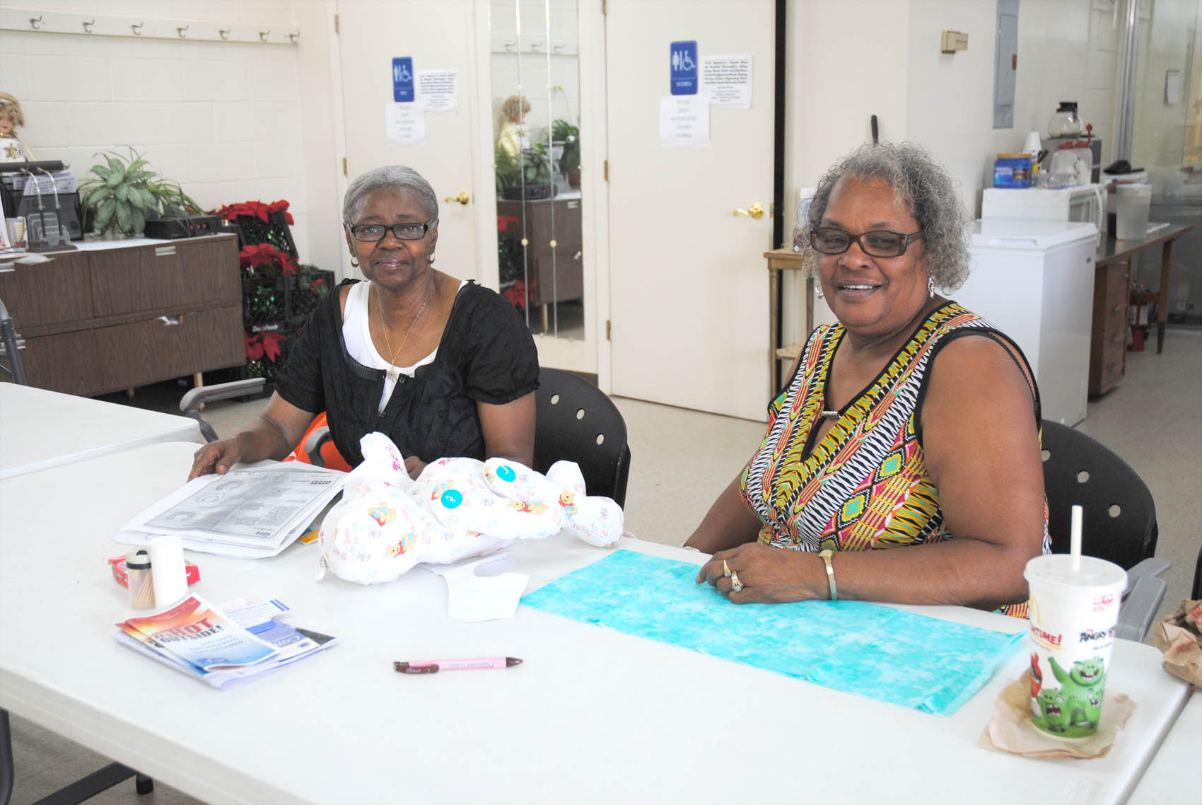 Click to enlarge,  Mary F. McLean and Doris Olds, members of the Dunn Senior Enrichment Center, create an adorable stuffed bear at the soon-to-be relocated center.  