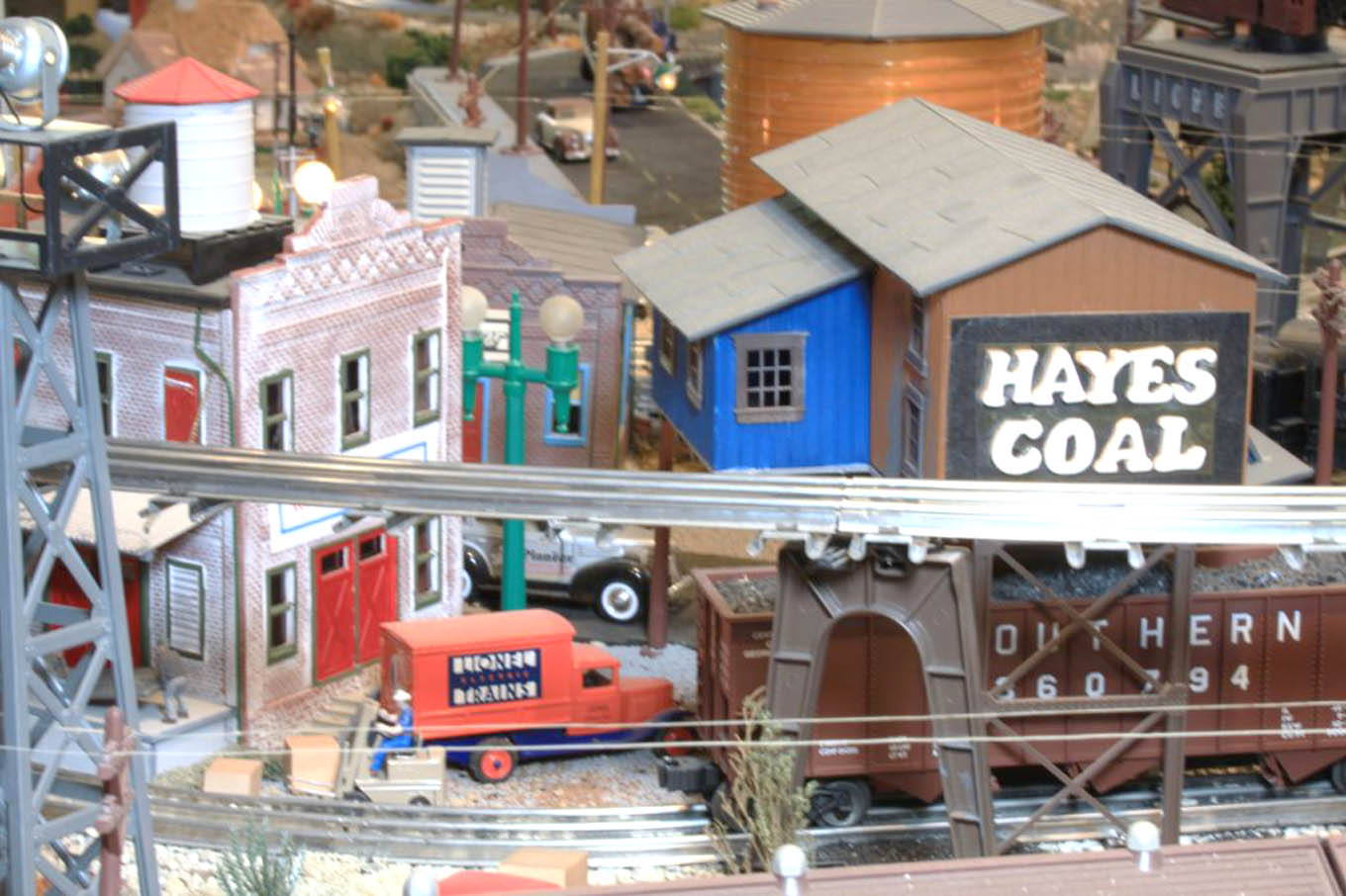 Click to enlarge,  Richard Hayes' train layout took two years to build on weekends as he traveled during the week. 'My train layout ... I fashioned after both the downtown Sanford train station and Hayes Coal Company and train yard environs, to an imagined rural country side and farm scenes traversed by the trains, turning into a mountain section with tunnels and bridges for the trains to negotiate,' said Hayes. 