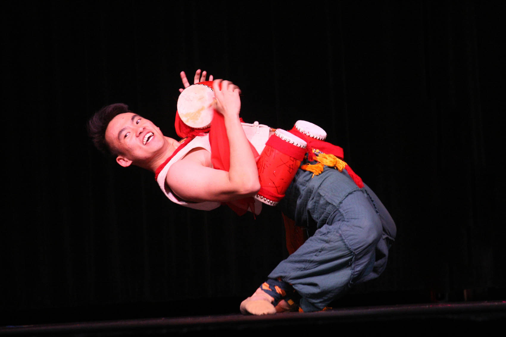 Click to enlarge,  Yang Yijie performs "Drums for Fun," an acrobatic duet with dance partner Chen Bocheng that was one of 10 performances drawing rave reviews from an appreciative audience in Sanford. 