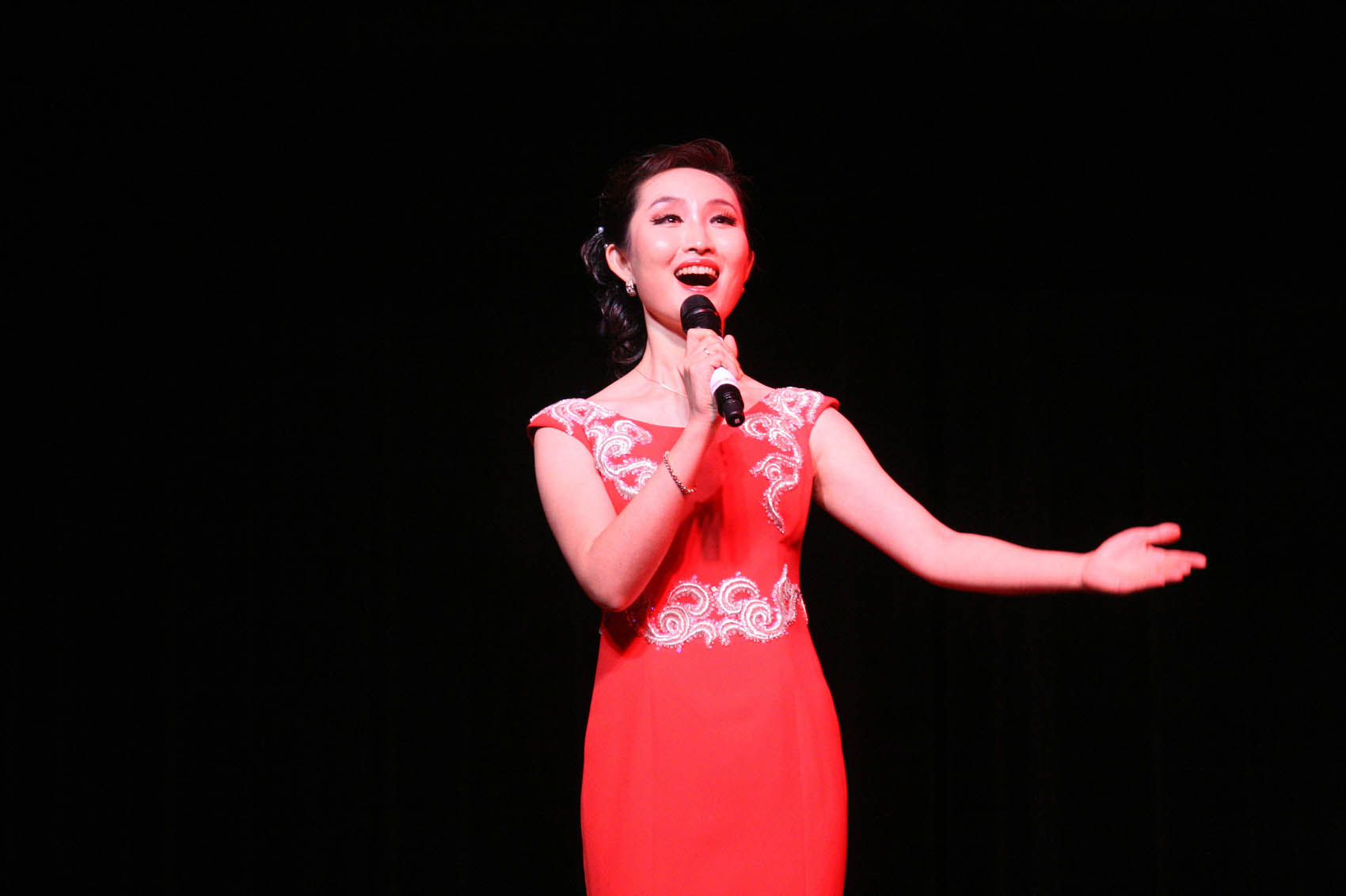Click to enlarge,  Soprano soloist Zhou Na from Shanxi University performs "Mayeel Variations" during an afternoon of Chinese music and dance at the Dennis A. Wicker Civic Center in Sanford. 