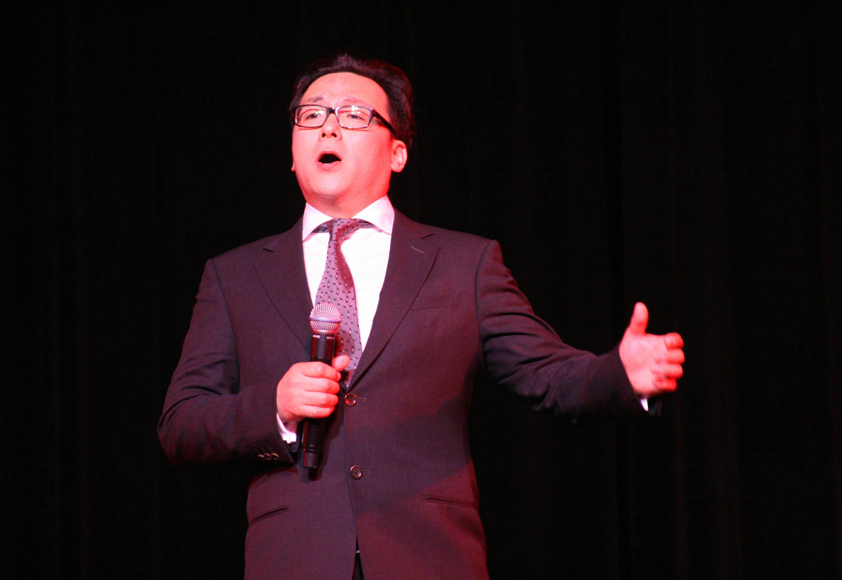 Click to enlarge,  Tenor soloist Li Yanfeng performs "Shanxi Pastoral Song," the first vocal number in an hour-long performance by Shanxi University artists that dazzled a packed house at the Dennis A. Wicker Civic Center. 