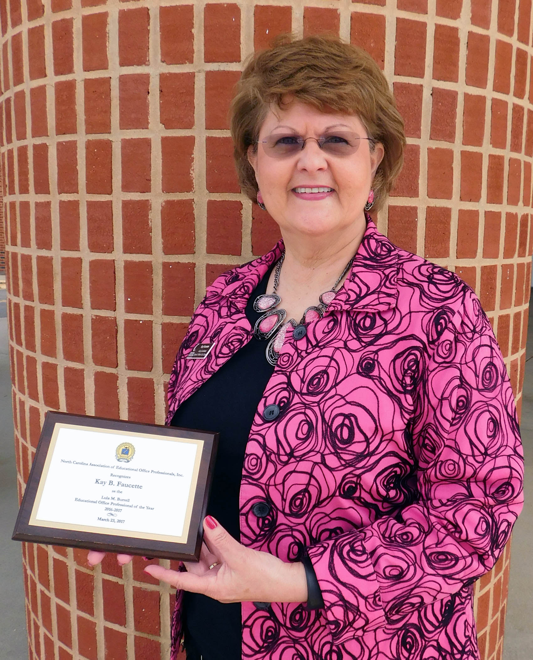 Click to enlarge,  Kay B. Faucette, Facility Coordinator for the Dennis A. Wicker Civic Center, has been awarded the Lula M. Burrell Educational Office Professional of the Year 2016-2017 by the N.C. Association of Educational Office Professionals, Inc. The award was presented on Thursday, March 23, in Winston-Salem. 