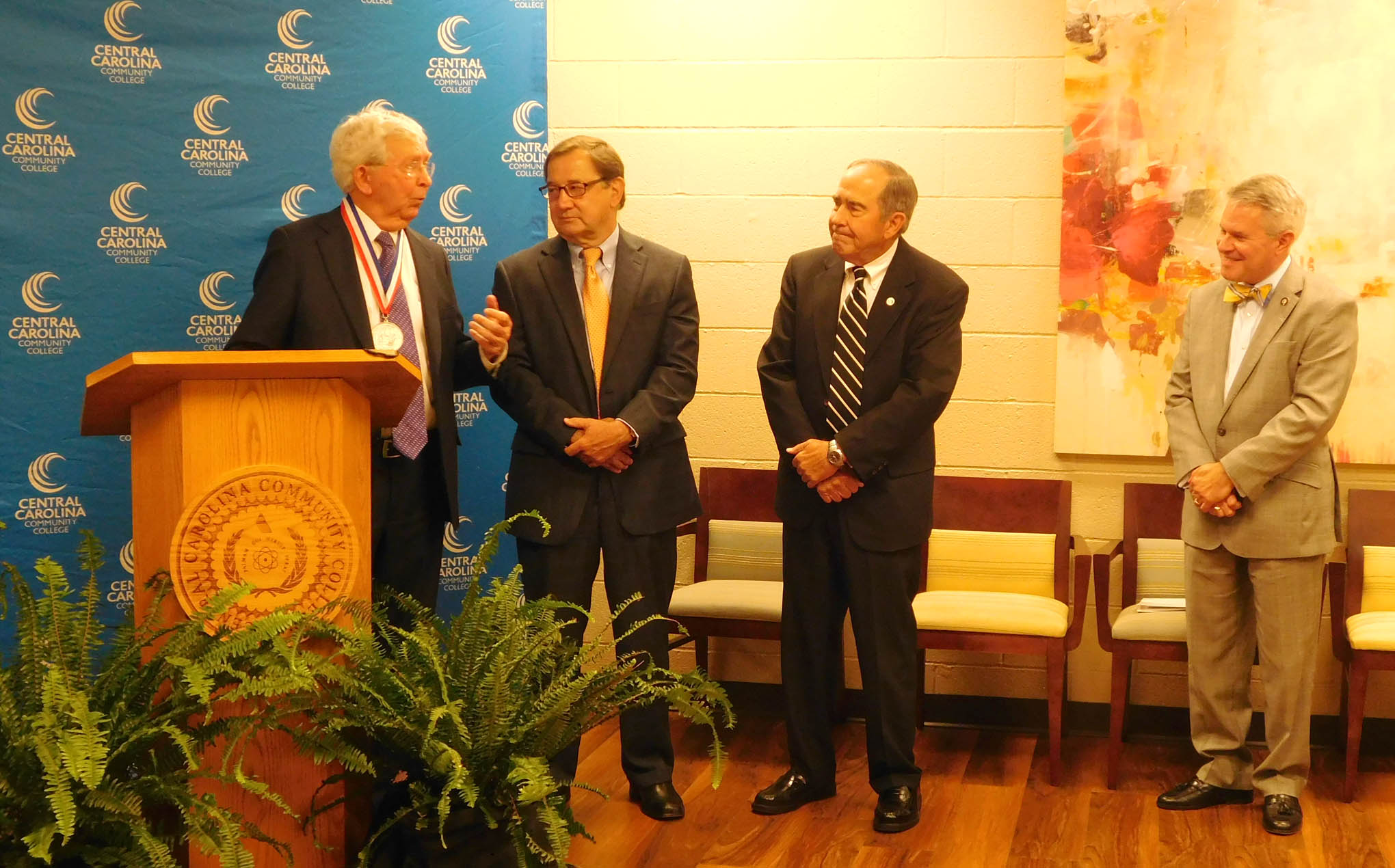 Click to enlarge,  Dr. J.F. Hockaday (far left), the latest recipient of the I.E. Ready Award, the highest honor bestowed by the State Board of Community Colleges, visits with (left to right) Dr. Donny Hunter, President and CEO of the N.C. Association of Community College Trustees; Dr. Ronald Lingle, President Emeritus of Coastal Carolina Community College; and Dr. James C. Williamson, President of the North Carolina Community College System. 
