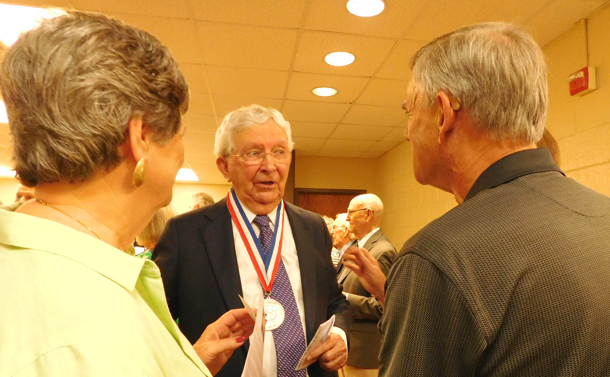 Click to enlarge,  Dr. J.F. Hockaday (left), president of Central Carolina Community College from 1969 to 1983, and recipient of the I.E. Ready Award, visits with award reception attendees. 