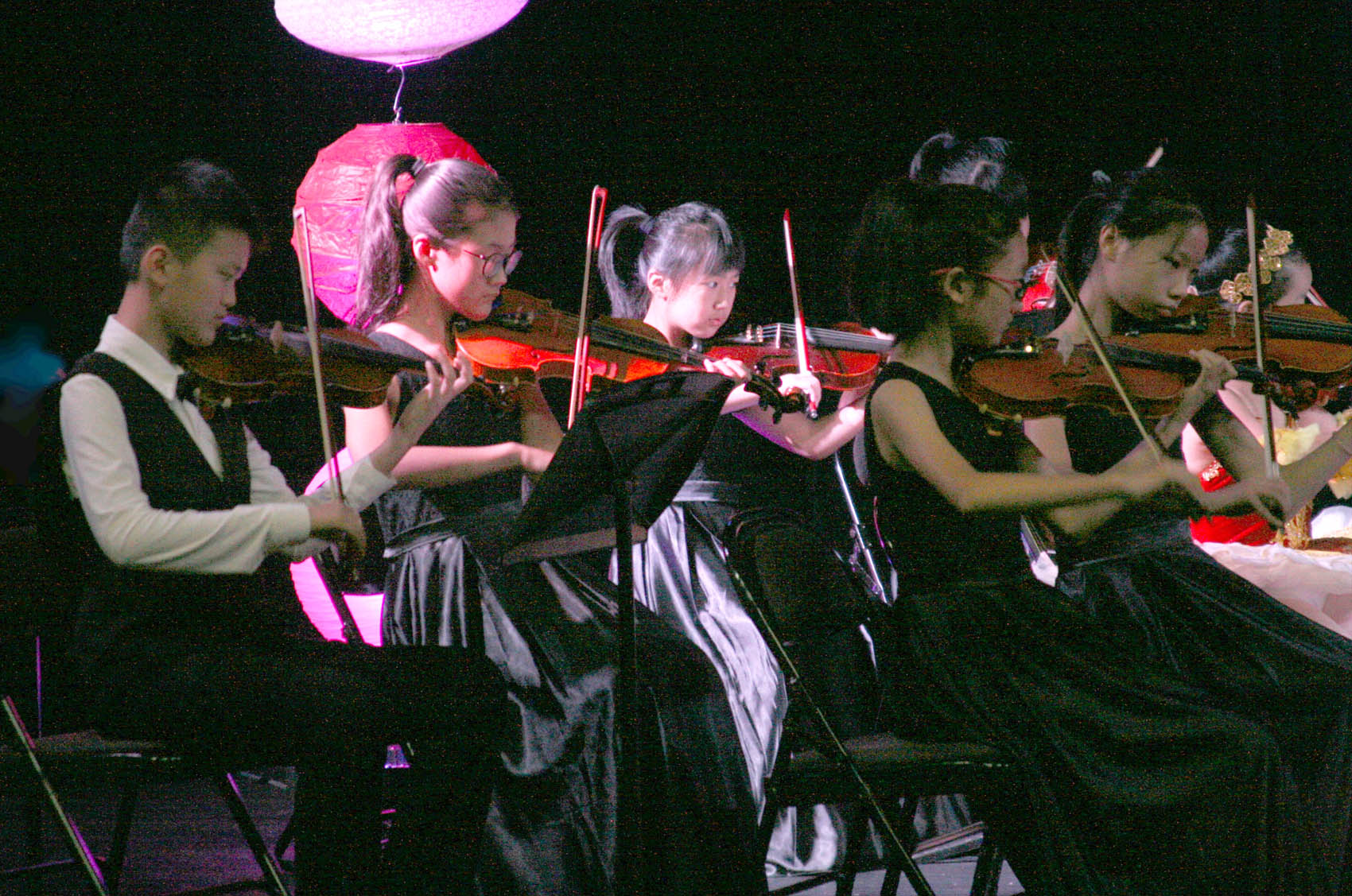 Click to enlarge,  Members of the Xiangyang Youth Philharmonic Orchestra perform at the Dennis A. Wicker Civic Center in Sanford. 