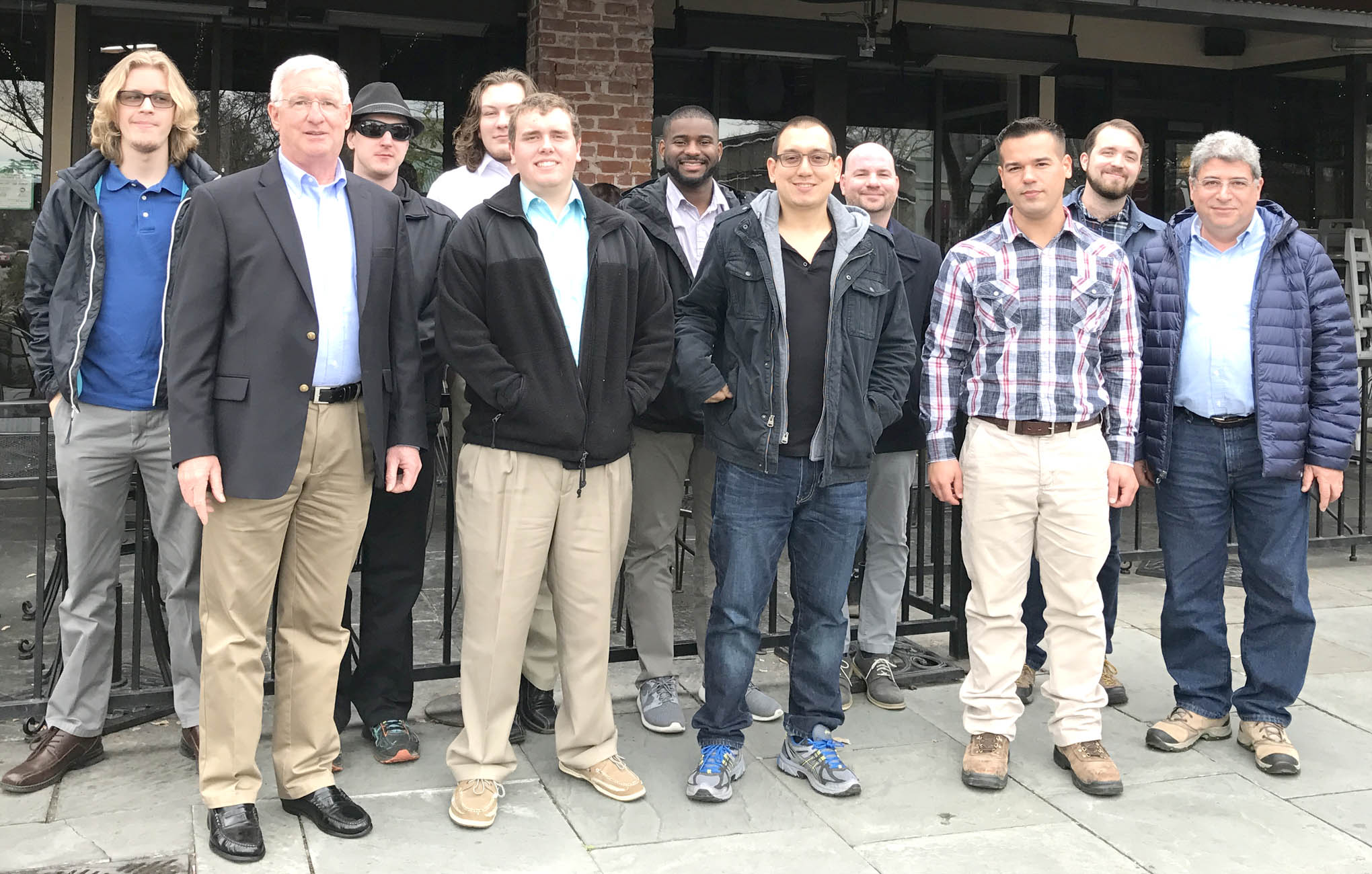 Click to enlarge,  Second-year students in the Laser and Photonics Technology program at Central Carolina Community College had lunch with previous CCCC Laser graduates following the LLNL tour. Pictured are, left to right: Seth Kuenzler, Gary Beasley, Michael Kropp, Darin Anderson, Derrick Kuhl, Jamal Robinson, Al Delong, Nickolas Jorgenson, Thomas Martin, David Pope, and Chrysanthos Panayiotou (LASER-TEC Principal Investigator). 