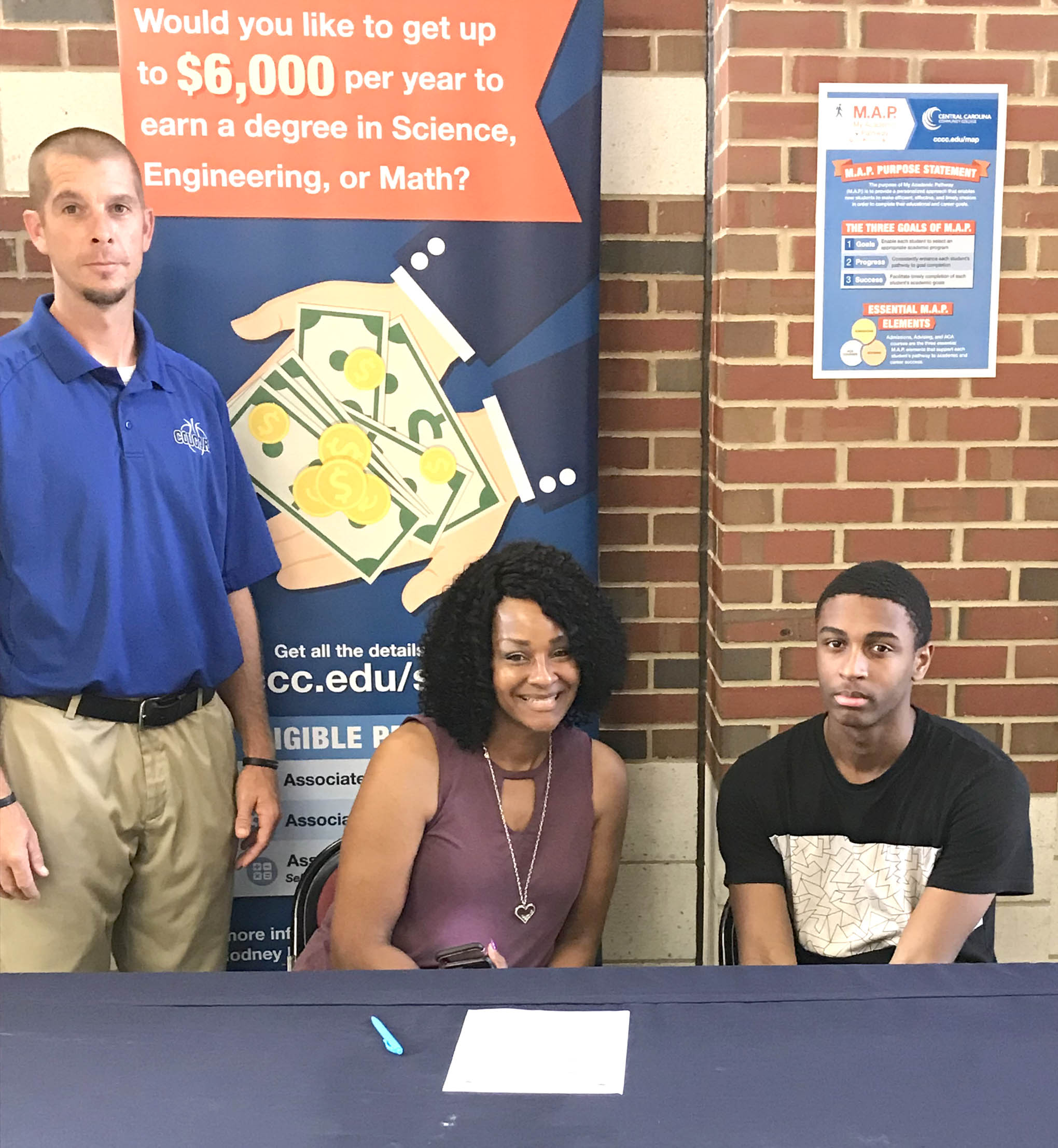 Click to enlarge,  CJ Stone (right), of Lee County High School, Sanford, recently announced his decision to join the Central Carolina Community College men's basketball program. 