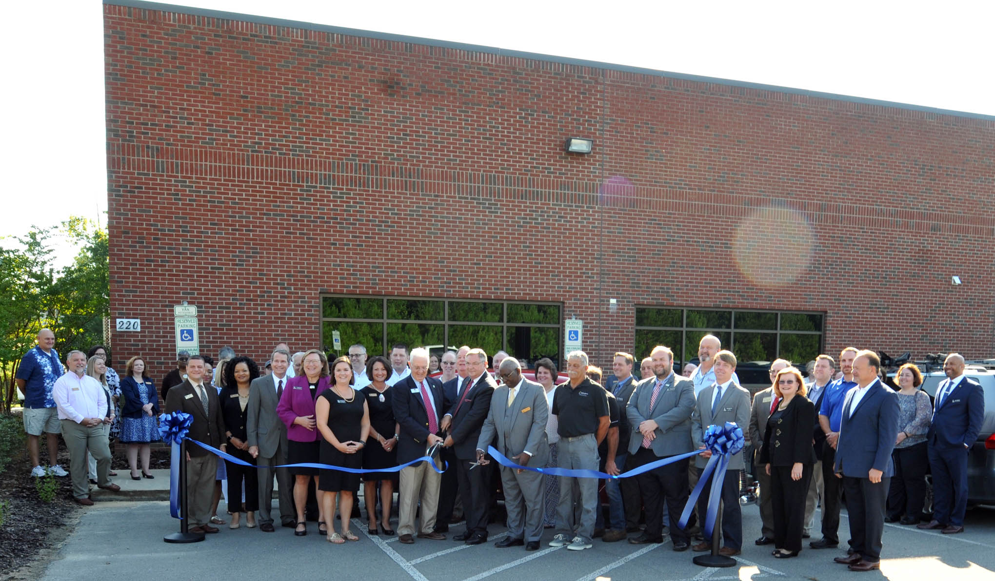 Click to enlarge,  The Central Carolina Community College Board of Trustees and Foundation Board hosted a ribbon-cutting event to celebrate the opening of the West Harnett Center Automotive Restoration Facility on Thursday, Aug. 9. 