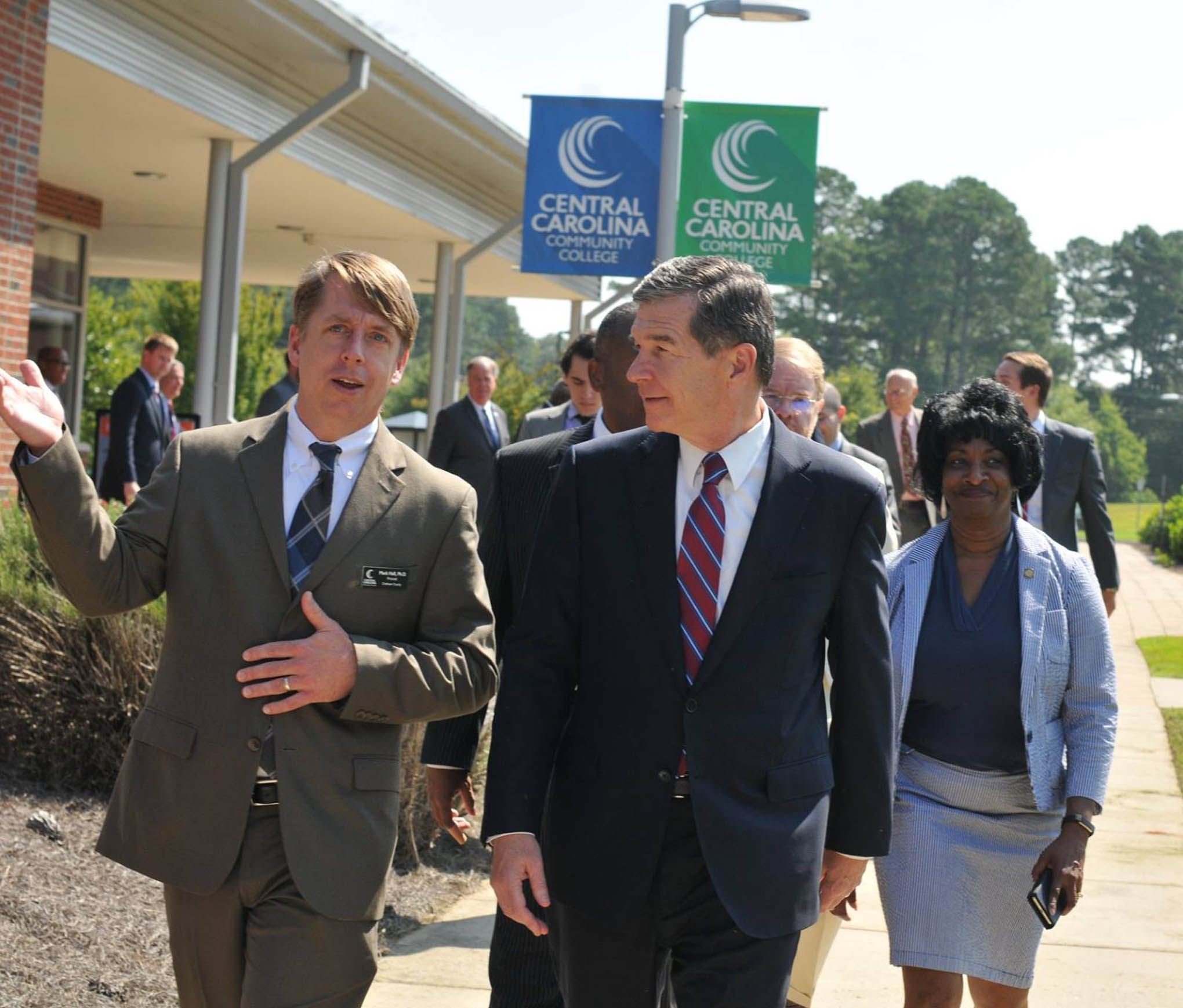 Click to enlarge,  Central Carolina Community College Chatham Provost Dr. Mark Hall (left) escorts N.C. Gov. Roy Cooper on a tour of the CCCC Chatham Main Campus in Pittsboro on Thursday, Aug. 23. 