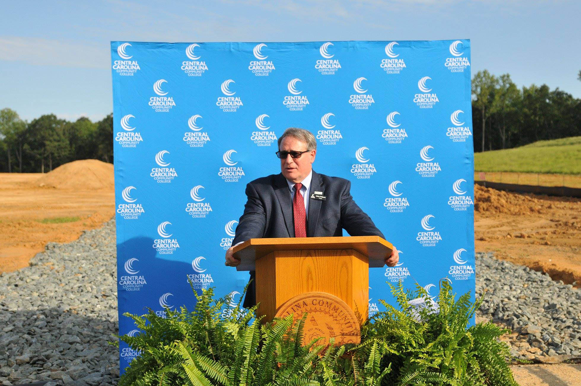 Click to enlarge,  Julian Philpott, Chairman of the Central Carolina Community College Board of Trustees, spoke to attendees at the college's Aug. 22 groundbreaking ceremony for the new Chatham Health Sciences Center. 