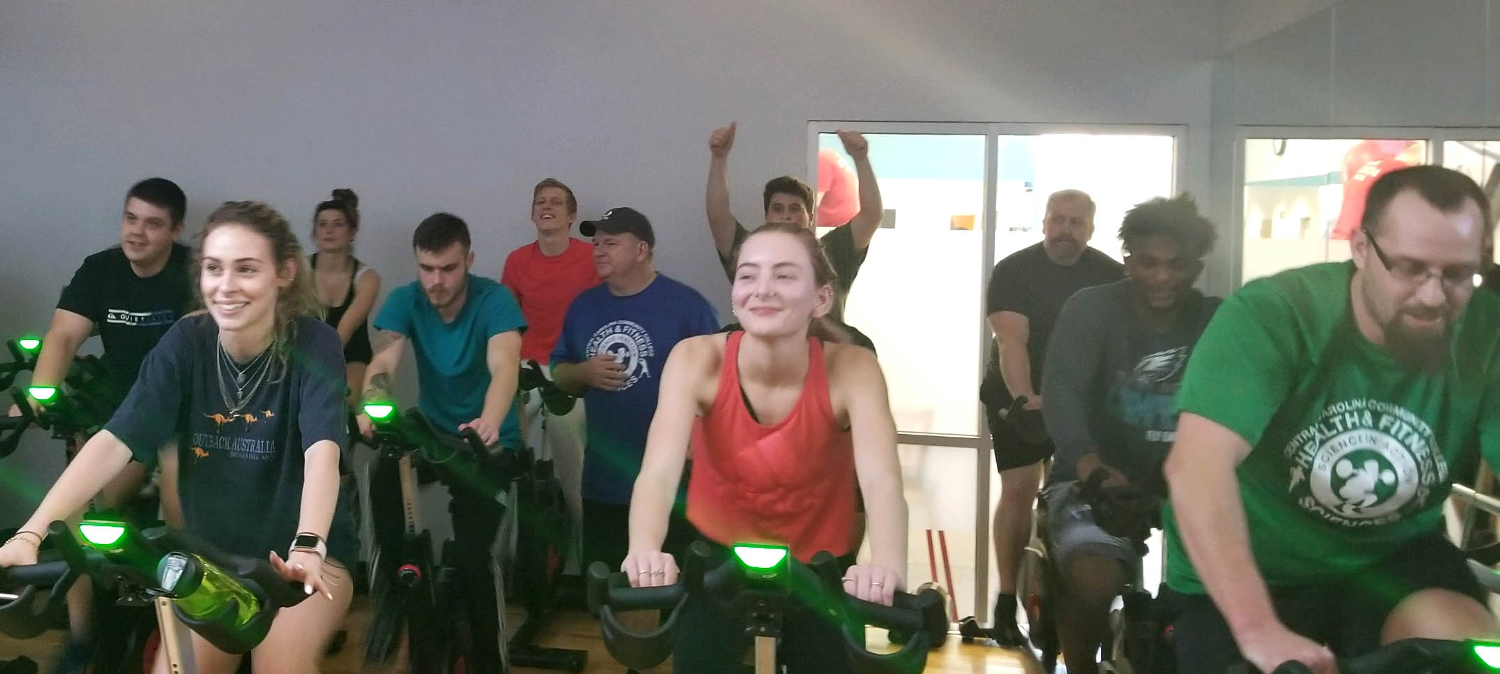 Click to enlarge,  Central Carolina Community College Health and Fitness Science students participate in stationary bike exercises at Sanford's Ingram Family YMCA. 