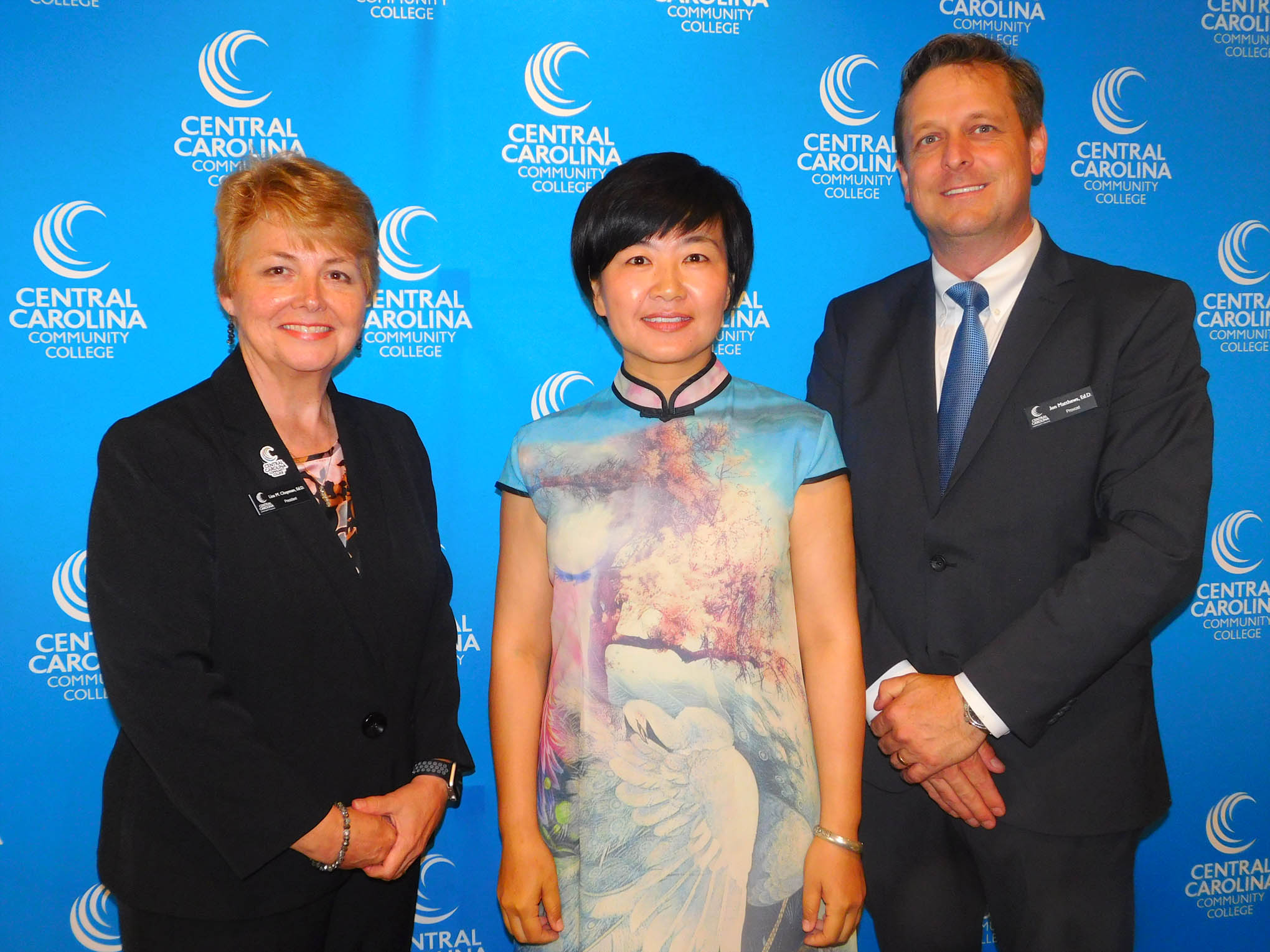 Click to enlarge,  Central Carolina Community College hosted a Ninth Anniversary and farewell honoring Yuehan Ma and the CCCC Confucius Classroom. Yuehan Ma is pictured in center with CCCC President Dr. Lisa M. Chapman at left and CCCC Harnett Provost Dr. Jon Matthews at right. 