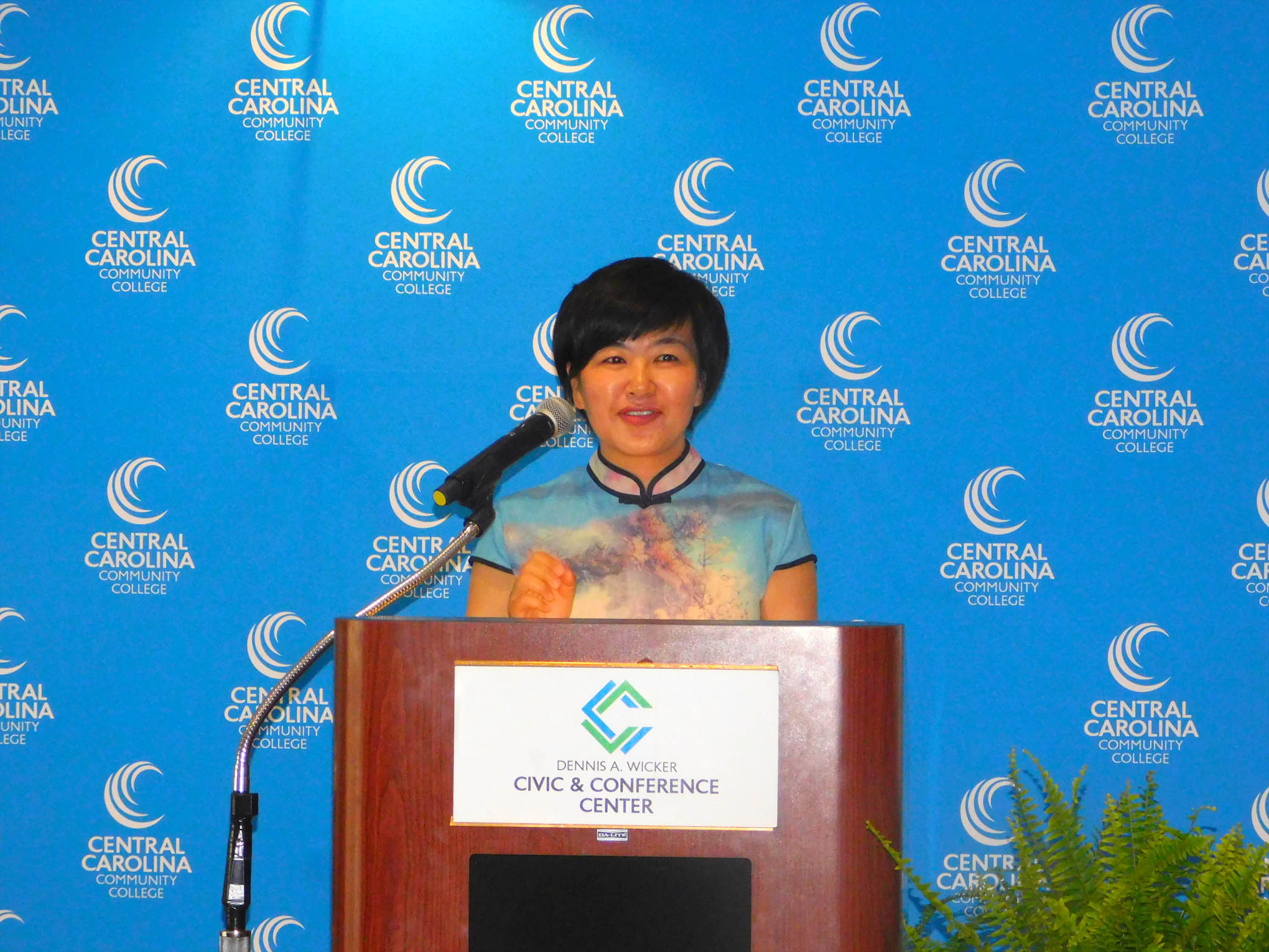 Click to enlarge,  Central Carolina Community College hosted a Ninth Anniversary and farewell honoring Yuehan Ma (pictured here at podium) and the CCCC Confucius Classroom. 