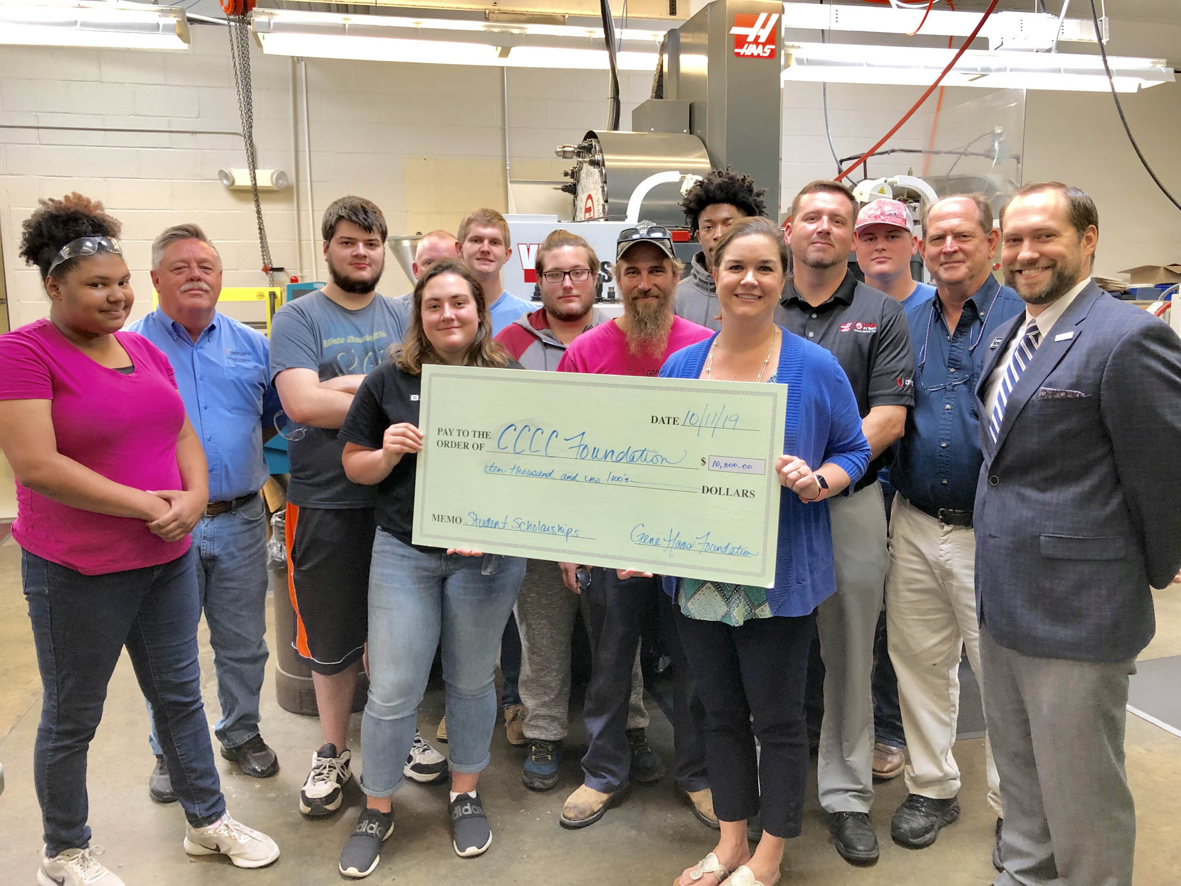 Click to enlarge,  Students, faculty, and staff involved in Central Carolina Community College's Computer Integrated Machining program are thankful to the Gene Haas Foundation for providing $10,000 in scholarship support to the program. Presenting the check to the college was Bill Cranford, Sales Engineer with Haas Factory Outlet, a division of Phillips Corporation. 