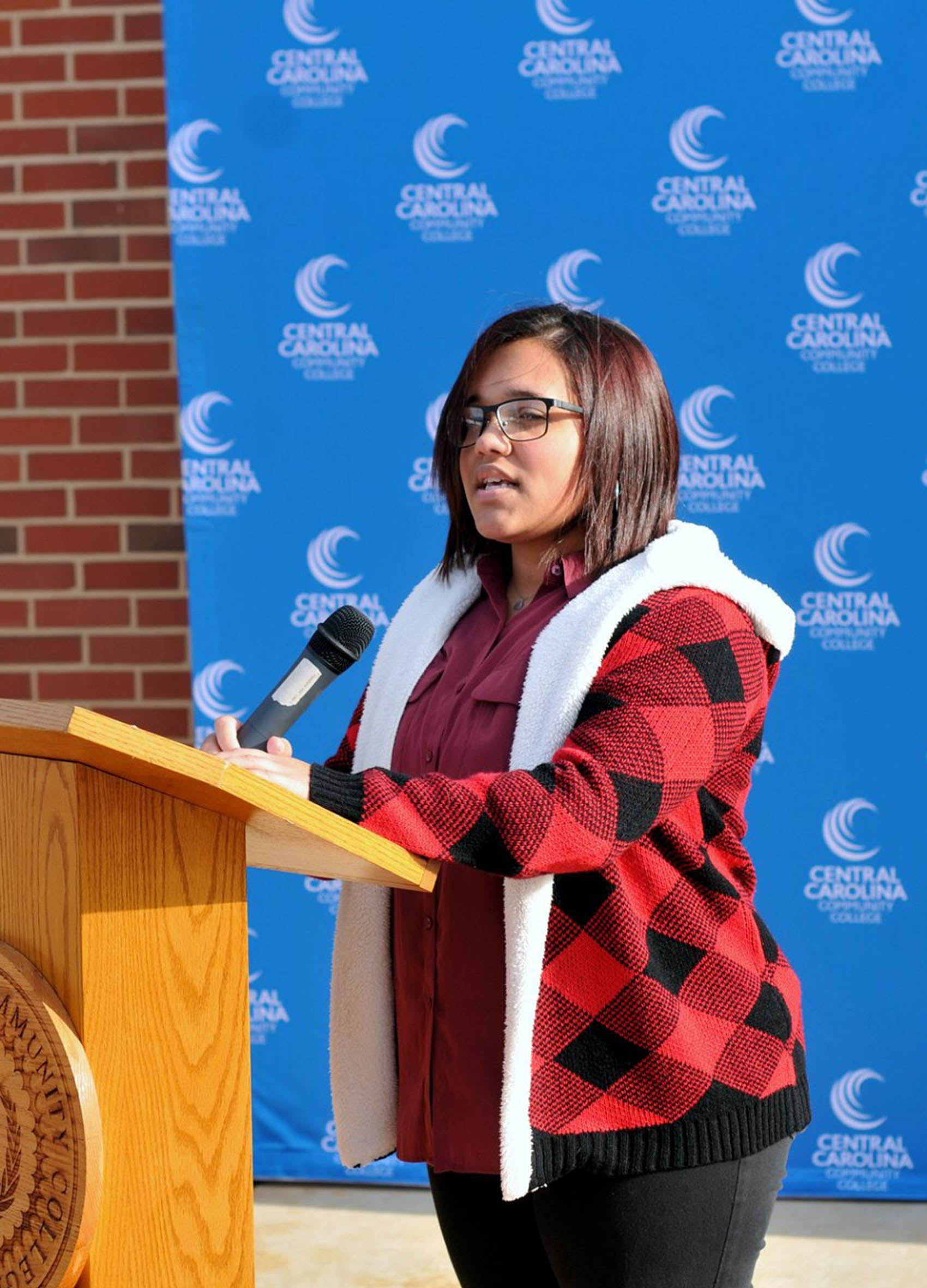 Click to enlarge,  Natasha Galloza Rosado speaks during a Veterans Day Ceremony held Monday, Nov. 11, at the Central Carolina Community College Lee Main Campus in Sanford, N.C. 