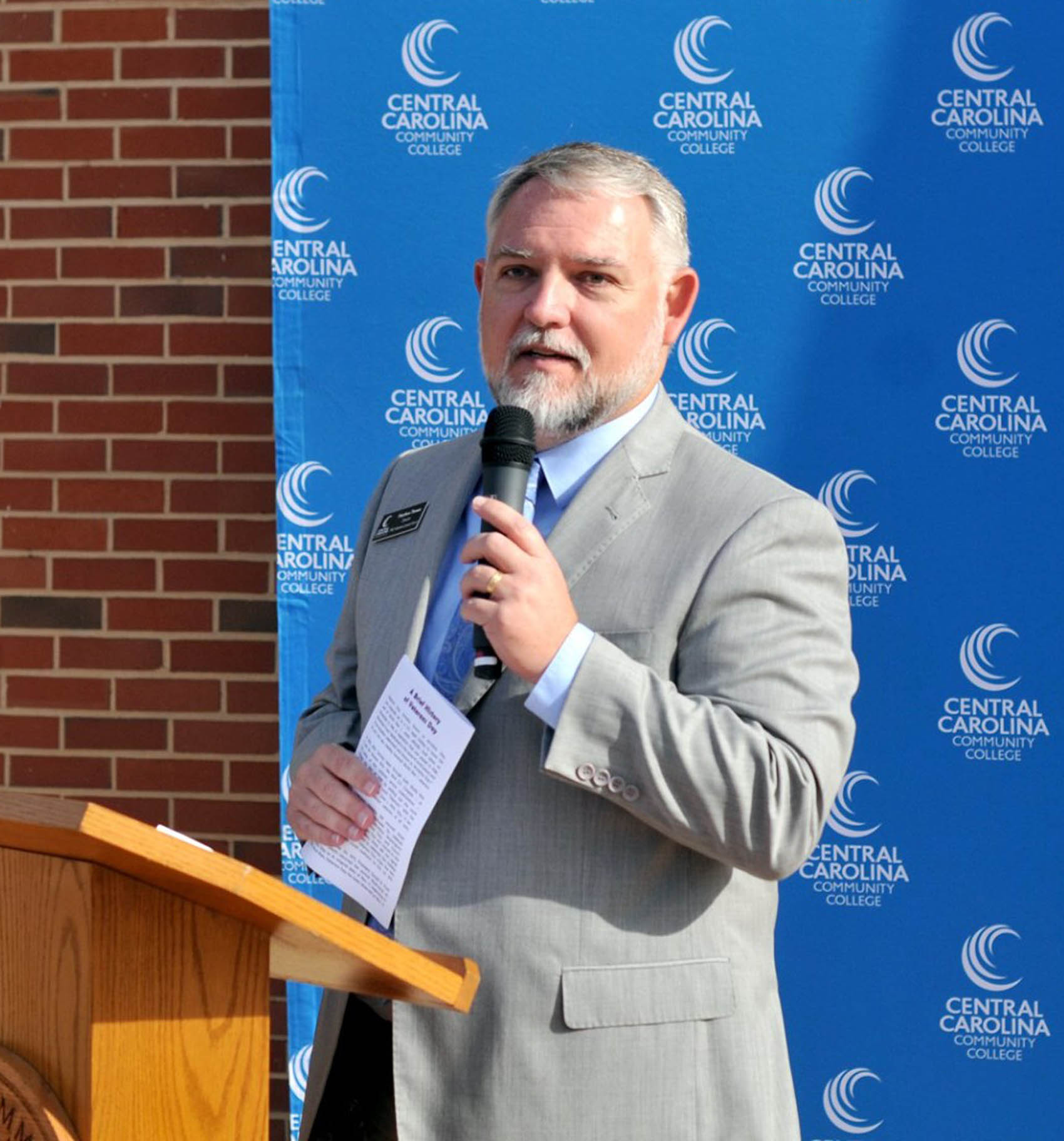 Click to enlarge,  Matt Thewes, CCCC Director of Veterans Upward Bound and U.S. Air Force Retired, speaks during a Veterans Day Ceremony held Monday, Nov. 11, at the Central Carolina Community College Lee Main Campus in Sanford, N.C. 