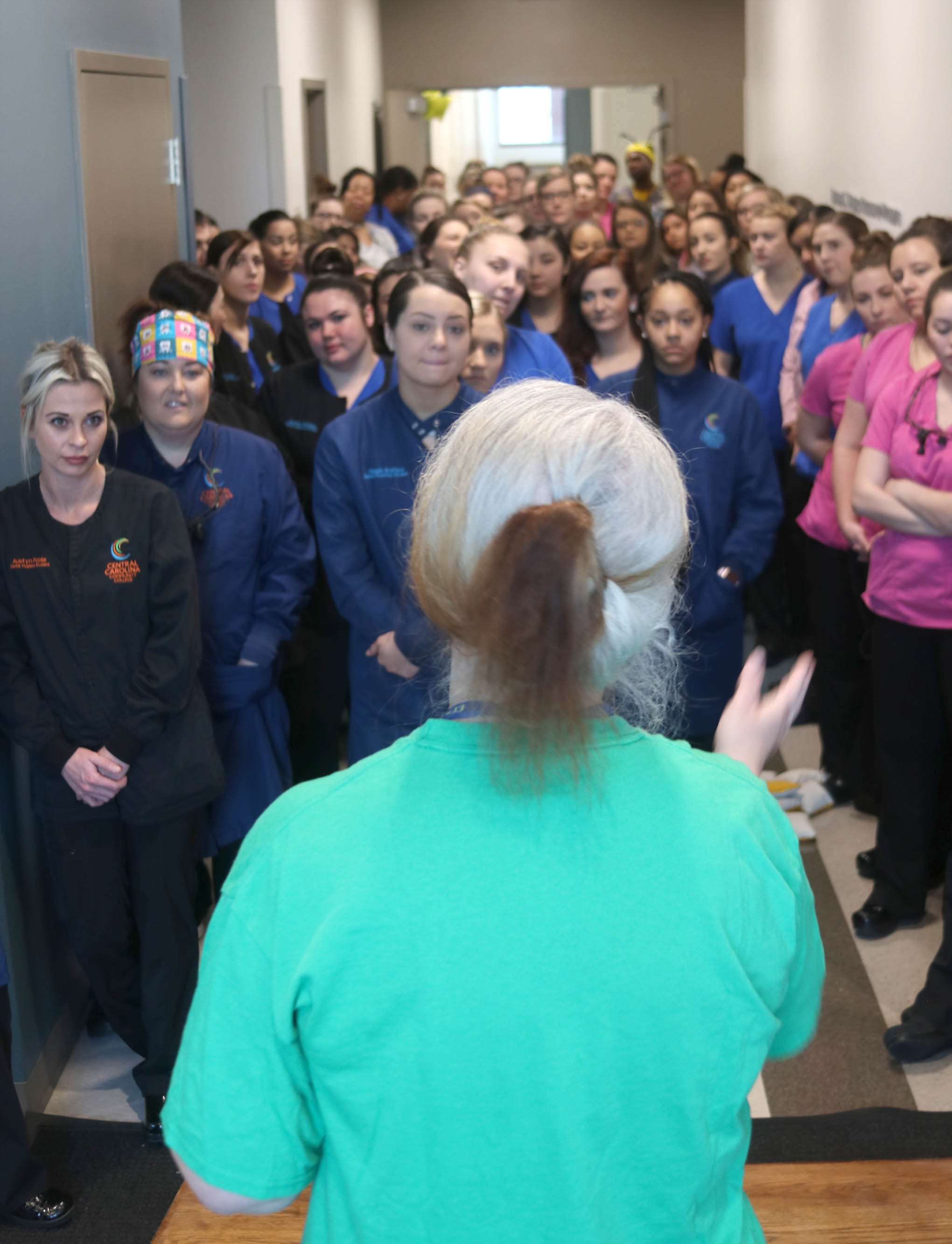 Click to enlarge,  Central Carolina Community College Dental Programs Department Chair Vicky Wesner prepares Dental Programs students for the events of the day. 