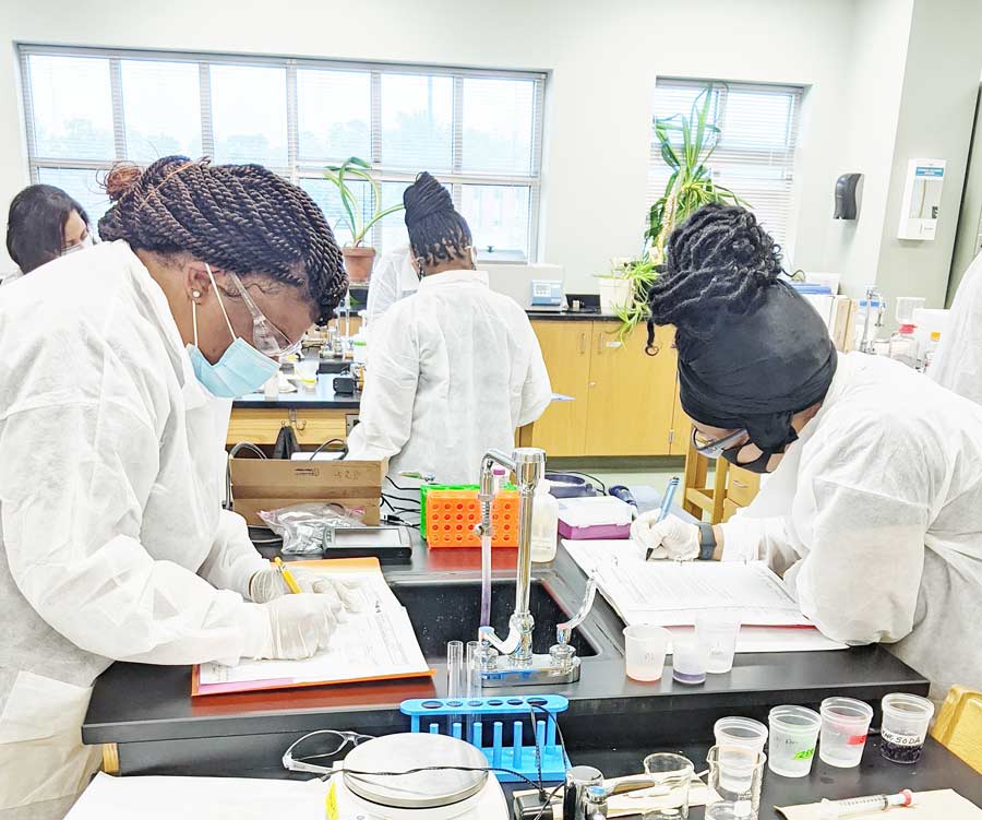 Click to enlarge,  Students participate in laboratory training in the 2020 Central Carolina Community College BioWork program class. 