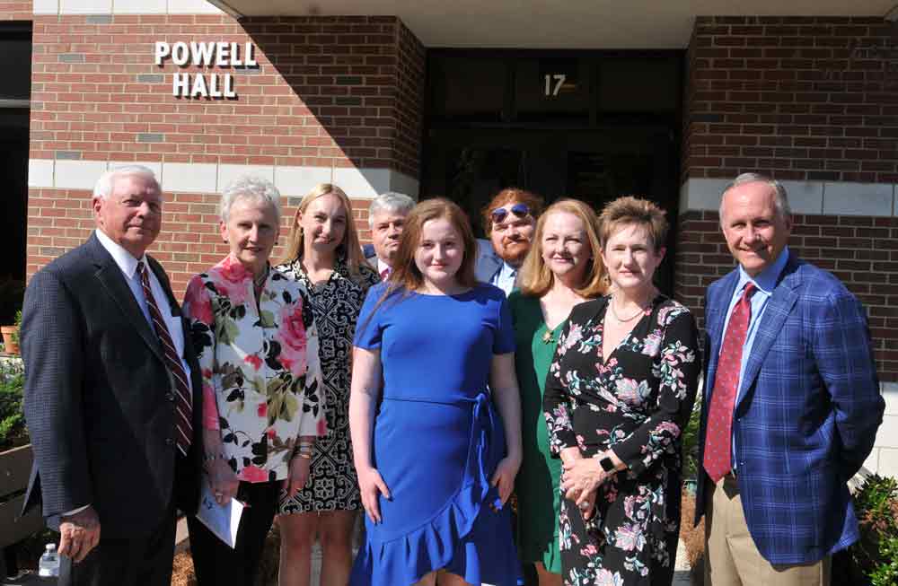 Click to enlarge,  The Bobby and Linda Powell family stands in front of Powell Hall on the Central Carolina Community College Lee Main Campus in Sanford. 