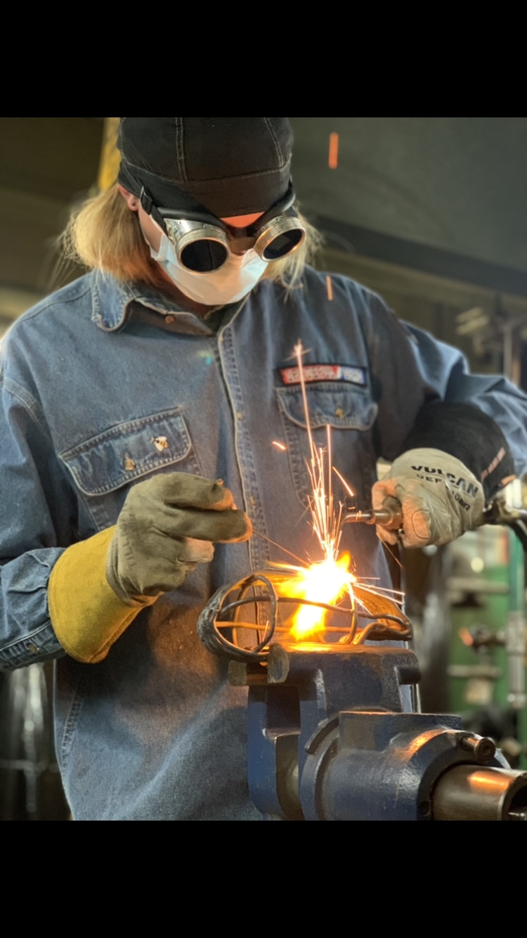 Click to enlarge,  Michael Sikinger at work on a welding project. 