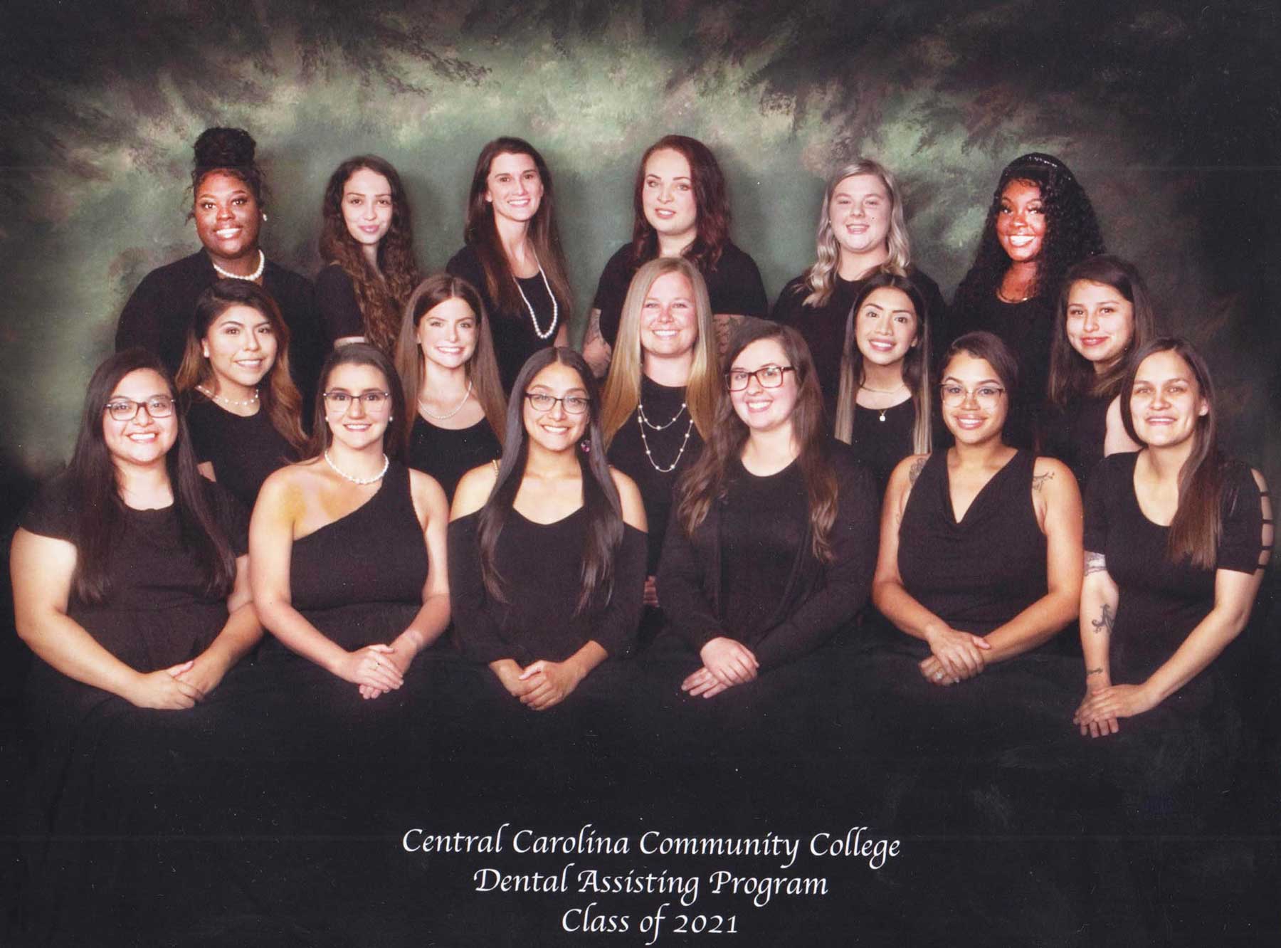 Click to enlarge,  The Central Carolina Community College Dental Assisting Class of 2021 held its pinning ceremony on Wednesday, July 21. Class members - with home counties listed -- are pictured, left to right: first row, Yoana Aguirre-Morales (Chatham), Christine White (Lee), Jasmine Garcia (Richmond), Lauren Ammons (Harnett), Addonus Frazier (Lee), and Tiffany Talbert (Moore); second row, Cynthia Ocampo (Lee), Anna Westbrook (Harnett), Chasity Perez (Harnett), Zaidaly Santiago (Chatham), and Yesenia Alvarado-Gutierrez (Lee); third row, Daijah Allen (Cumberland), Eden Pruitt-Harris (Lee), Kristin Vause (Lee), Michala Szubinski (Moore), Haley Godfrey (Lee), and Brianna Bennett (Harnett); not pictured, Jasmine Marcano (Hoke). The CCCC Dental Assisting program is ranked as the No. 2 Best Dental Assistant School in North Carolina - 2021 by NursingProcess.org. For more information on the CCCC Dental Assisting program, visit www.cccc.edu/curriculum/majors/dental/assisting/. 