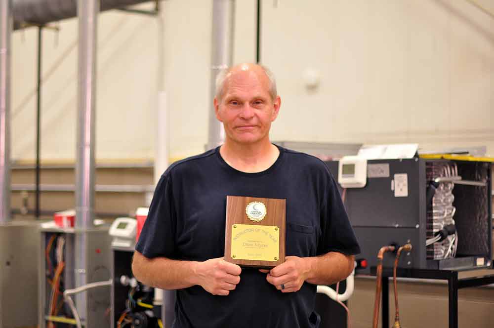 Click to enlarge,  David Myers has received the Central Carolina Community College Instructor of the Year Award. Mr. Myers, who was recognized at the recent CCCC Convocation program, is Lead Instructor of the CCCC Air Conditioning, Heating, and Refrigeration Program. 