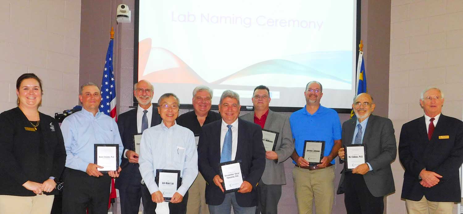 Click to enlarge,  Central Carolina Community College has recognized 11 individuals for their contributions to the college's Laser and Photonics Technology program. CCCC Foundation Executive Director Dr. Emily Hare (far left) and Gary Beasley (far right), who leads the CCCC Laser &amp; Photonics Technology program, are pictured with honorees (left to right): Kevin Stevens, Steve Lympany, Ich-Kien Lao, Scott Hamlin, Chrysanthos "Chrys" Panayiotou, Scott Williams, Jeremy Johnson and M.J. Soileau. 