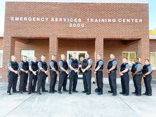 Click to enlarge,  Thirteen individuals are among the most recent graduates of the Central Carolina Community College Basic Law Enforcement Training (BLET) program. They are, left to right: Brannon Rhodes, Glenn Twigg, Caleb Norris, Bailey Riddle, Juan Fernandez, Zachary Gross, Arnold Banks, Brandon Mayer, Christopher Cary, Matthew Ehrlich, Samuel Truelove, Damien Eason, and Silvia Rocha. 