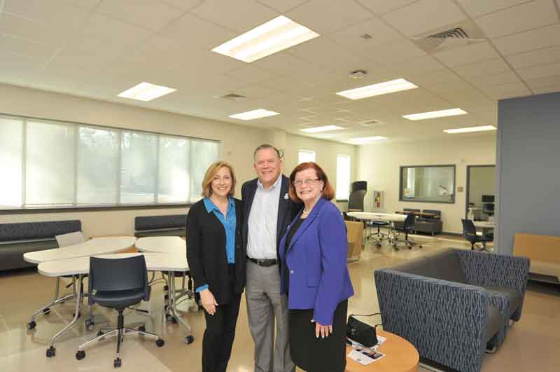 Click to enlarge,  Kirk J. Bradley (center) and wife Deanne (left) visit with Central Carolina Community College Foundation Board of Directors Chair Lynda Turbeville (right) in the Kirk J. Bradley Student Center located on CCCC's Chatham Health Science (CHSC). Ms. Turbeville noted in her comments: 'Kirk Bradley is a visionary who has changed the educational footprint for thousands of students. Due to his dedication, he has impacted the lives of countless students who have gone forward to achieve their educational dreams and goals.' 