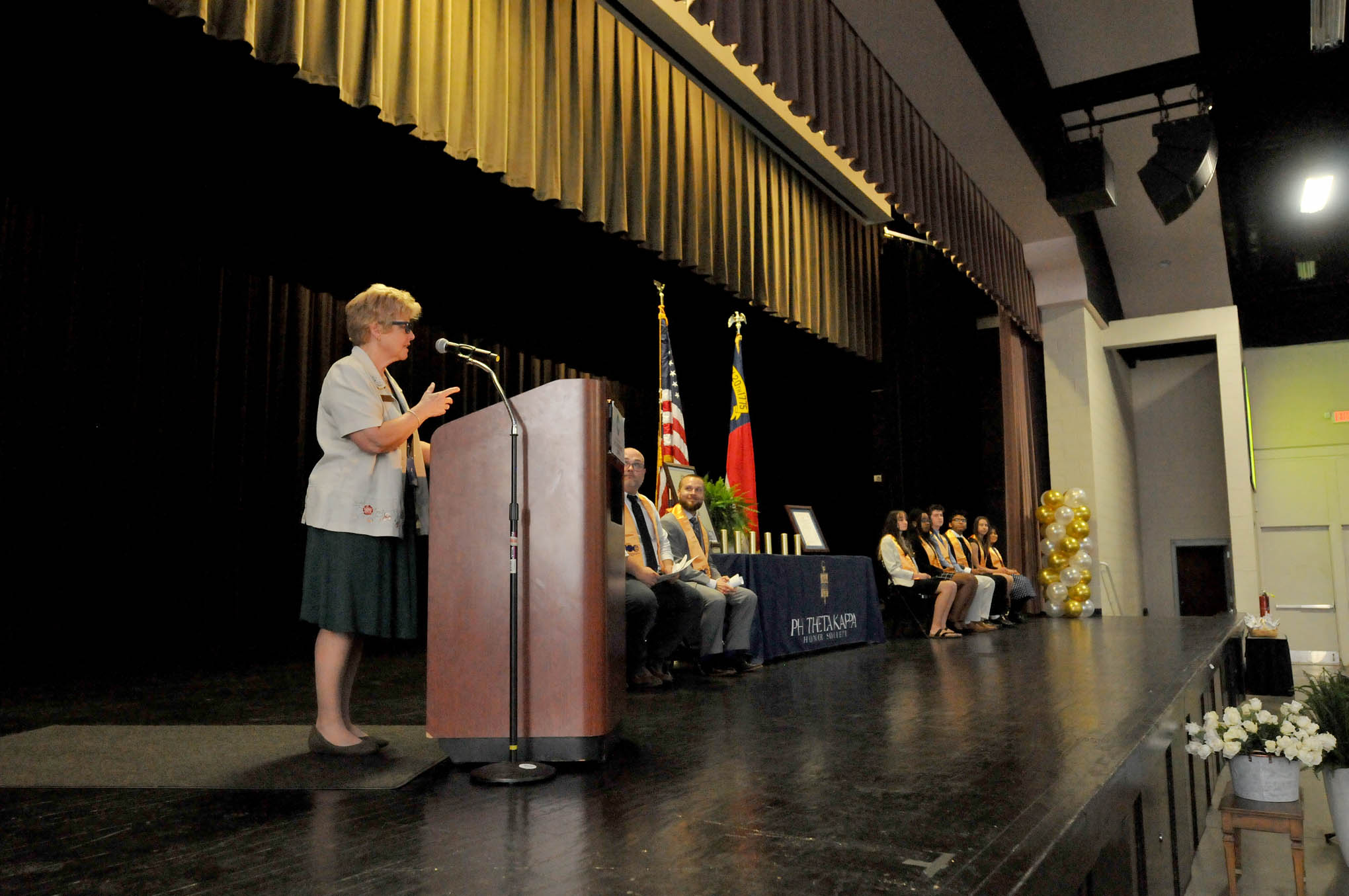 Click to enlarge,  Central Carolina Community College President Dr. Lisa M. Chapman speaks at the CCCC Beta Sigma Phi Chapter of Phi Theta Kappa International Honor Society induction ceremony. 