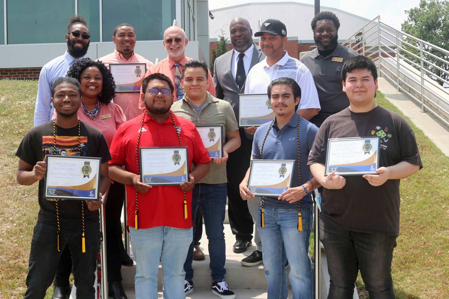 Click to enlarge,  Central Carolina Community College Brothers of Excellence award recipients along with mentors / advisors include, left to right: first row, Brent Alexander, Jairo Diaz, Hector Ramirez, and Roberto Morales; second row, Candice Solis, Leo Hernandez Cristobal, and Rickie Rembert; third row, Zack Ledwell, Kenneth Caraway, Gary Blankenship, Doug Wells, and Anthony Farrior. 