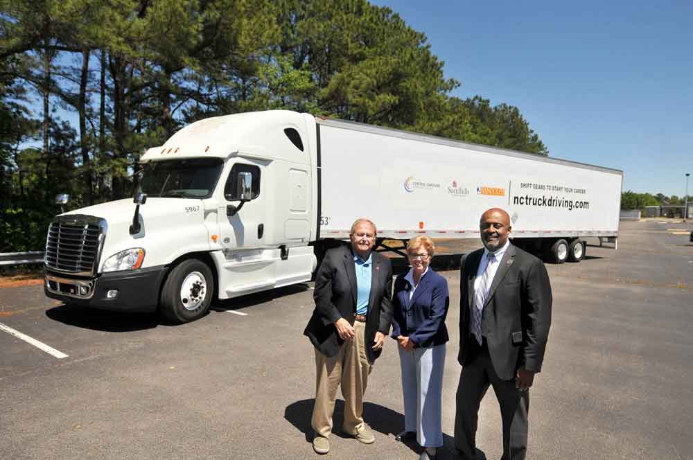 Click to enlarge,  Central Carolina Community College, Randolph Community College, and Sandhills Community College have joined efforts to offer a regional truck driving and logistics program. Pictured are Sandhills CC President Dr. John R. Dempsey, CCCC President Dr. Lisa M. Chapman, and Randolph CC Vice President for Workforce Development &amp; Continuing Education Elbert Lassiter. Learn more about this program at nctruckdriving.com. 