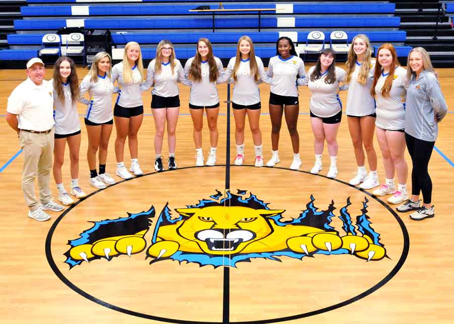 Click to enlarge,  Members of the Central Carolina Community College 2022 volleyball team are pictured, left to right: Coach Dal Langston, Zoey Hodges, Felisha Chavez, Halan Raynor, Tessa Wisniewski, Anna Smith, Karli Bullard, Alexis McDougald, Natalia Brocious, Kammi Naude, Anna Strickland, and Coach Brittany Ter Meer. 