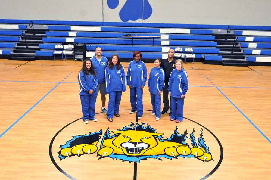 Click to enlarge,  Members of the Central Carolina Community College 2022 women's cross country team are pictured, left to right: front row, Emilie Obregon, Avery Blegen, Charmaine Robison, Kate Perez, and Lillian Bennett; second row, Coach Richard Briggs and Coach James Haynie. 