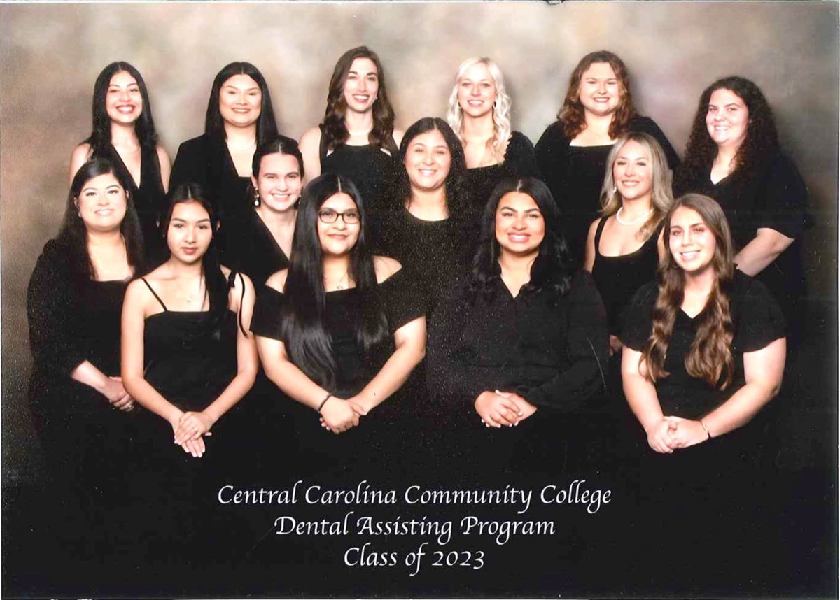 Click to enlarge,  The Central Carolina Community College Dental Assisting Class of 2023 held its pinning ceremony on Thursday, July 13. Class members - with counties of residence listed -- are pictured, left to right: first row, Aracely Guerrero - Lee County, Zitlali Villalba-Flores - Lee County, Ariel Edwards Kinlaw - Moore County, and Lana Klein - Harnett County; second row, Anahi Vivas - Lee County, Jomarys Figueroa - Cumberland County, Nayeli Gonzalez - Chatham County, and Jacqueline Salazar - Lee County; third row, Mayanin Castaneda Flores - Lee County, Anna Kane - Harnett County, Cameron Leonhardt Buttram - Wake County, Devin Scheer - Montgomery County, Emily Pearce - Harnett County, and Morgan Cummings - Moore County. Not pictured is graduate Kennedy Dial, Wake County. For more information on the CCCC Dental programs, visit www.cccc.edu/dental. 